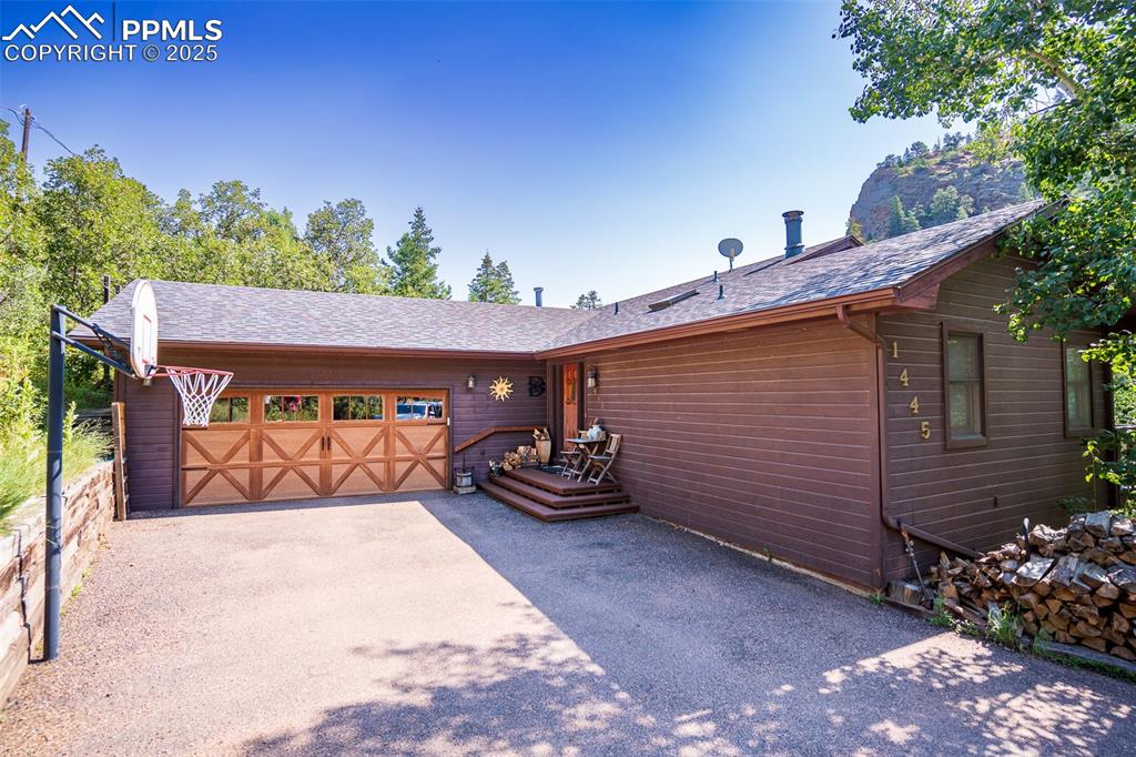 Nestled into the mountain side with mature trees and the sound of a nearby creek, this 4 bedroom 3 bath home offers both privacy and convenience. With over 2500 finished square feet, it features upper and lower wraparound decks, perfect for relaxing outdoors, soaking in the hot tub, or enjoying peaceful forest views.  The master bedroom opens to its own private deck, offering a quiet retreat to enjoy the natural surroundings. Inside, the home offers a walk out basement, 2 car garage, and thoughtful upgrades like a reverse osmosis water treatment system and water softener.  Located in a gated community, HOA amenities include a stocked trout pond, private trails, snow and trash removal, tennis, pickle ball, a heated summer pool and more!  Quiet, natural, and just minutes from town, this home blends mountain serenity with modern comfort.