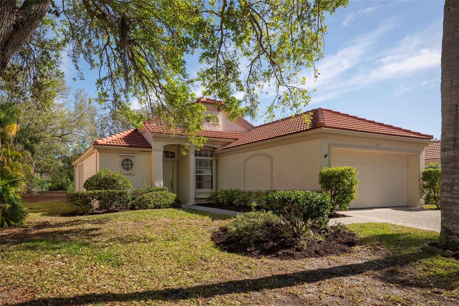 Location, Location, Location.  This 3 bedroom/2 bath home is located in Westwinds.  The home is in close proximity to all that Tarpon Springs has to offer, including beaches, boating, historic sponge docks and downtown restaurants.  The home has been beautifully maintained and thoughtfully updated.  The home features a new tile roof in 2023, gas water heater 2021, AC 2020, 4 Season back porch, indoor laundry room, new LED lighting, fans throughout, and hurricane shutters.  The popcorn ceiling was completely removed, reattached, taped/mudded, textured and painted in 2025.  Engineered hardwood floors run throughout the home with tile floors in the kitchen, laundry, and bathrooms. The HOA covers, lawn maintenance, sprinklers, and pest control allowing for true maintenance free living. Homes in this neighborhood rarely come available and this one will go quickly. Pack your bags and get ready to enjoy the good life.