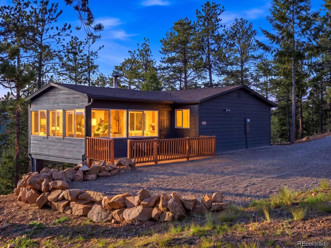 BIG MOUNTAIN VIEWS. TINY HOUSE. ENDLESS CHARM.Perched high among the treetops with sweeping panoramic mountain views, this adorable 1-bedroom + office mountain retreat proves that great things really do come in small packages. Completely remodeled and thoughtfully designed, this 620-square-foot home is the perfect escape from the everyday-or an incredible opportunity to own a low-maintenance mountain getaway in beautiful Conifer.Originally built in 1966, the home has been transformed with stylish updates while maintaining the cozy character that makes a mountain cabin feel like home. Wake up to expansive views through the trees, sip your coffee while watching the mountains change with the light, and enjoy the peace and privacy of a home tucked into the forest.The smart floor plan includes a comfortable bedroom, dedicated office space, inviting living areas, and everything you need for weekends in the mountains or simple full-time living. And then there are the views-truly the star of the show. From its mountain-top setting, the home captures breathtaking, treetop vistas and an incredible sense of being surrounded by Colorado's natural beauty.Located on a publicly maintained road, you'll enjoy the quintessential mountain lifestyle without sacrificing convenient access. Whether you're looking for a weekend escape, a first step into mountain ownership, a short-term getaway, or simply a place to slow down and soak in the views, this little gem delivers.Small footprint. Big personality. Unforgettable views. This is mountain living at its most charming.