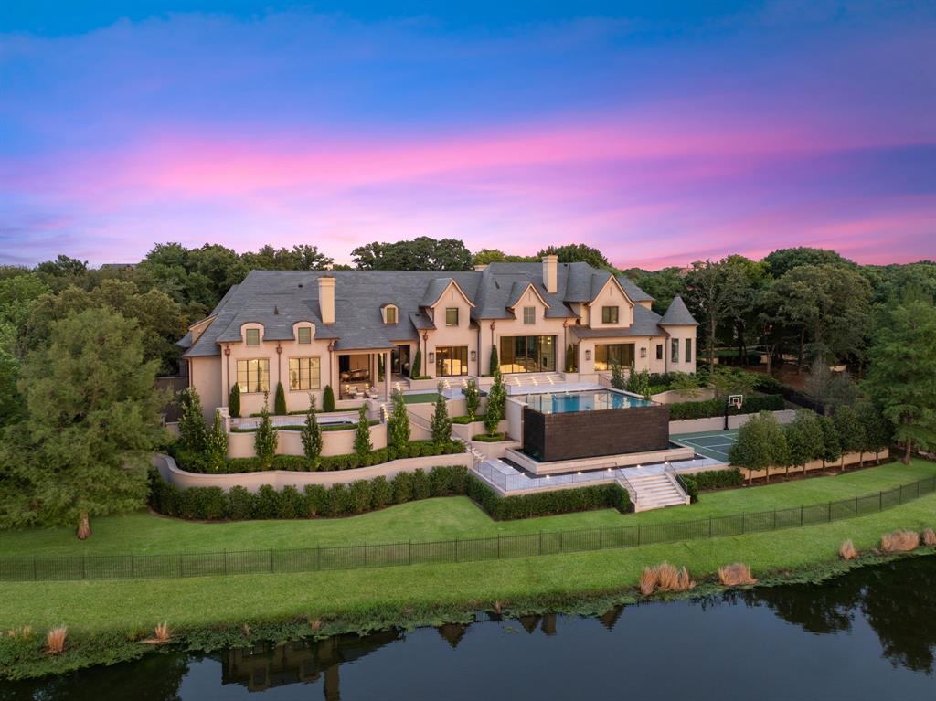 Setting the new benchmark for exceptional Westlake Real Estate, Philoxenia—a completely re-envisioned European-inspired estate—is the most Exquisite Home Ever Available for sale in the history of Westlake. Named for the ancient ideal of gracious hospitality, Philoxenia was built as a private luxury sanctuary, crafted for large-scale entertaining as well as quiet daily living. Nestled in the exclusive Vaquero community, this home was re-conceived throughout seamlessly blending with the highest level of finishes available in the world, classical European Architecture & the finest in modern design, all with an execution level never before available in Westlake. Set on Vaquero's most Prominent and Private homesite with unobstructed lake and Vaquero Golf Course views, the estate encompasses breathtaking vistas + a sense of harmony with nature. Using unparalleled finishes for the most discerning owners, the home features over 120 hand-selected marble slabs, custom millwork, quarter-sawn white oak herringbone floors, Nero Marquina and Calacatta Monet marble, custom doors with Joseph Giles London brass hardware, and Phillip Jeffries wall coverings. The Chef's Kitchen boasts an anthracite Lacanche Sully range, dual Miele dishwashers, a Thermador suite, and custom Italian oak cabinetry. Retire to the private Primary wing, a self-contained sanctuary, with incredible lake views, a Nero Marquina marble shower, Carrara block soaking tub, heated floors, custom Italian dressing room, and hidden Speakeasy. The Resort-caliber grounds with a gated entry, impressive meandering driveway, a lake-facing infinity pool with 14-foot textured black granite waterfall, full Outdoor Kitchen, Sport court, full Gym, Sauna, Steam room, Rafe room + state-of-the art Golf Simulator. Geothermal HVAC. Full RockWool acoustic insulation. Vantage lighting and integrated security. Plans for a future guest house available. Access to an Immediate Vaquero Golf Membership - once approved by the Vaquero Club.