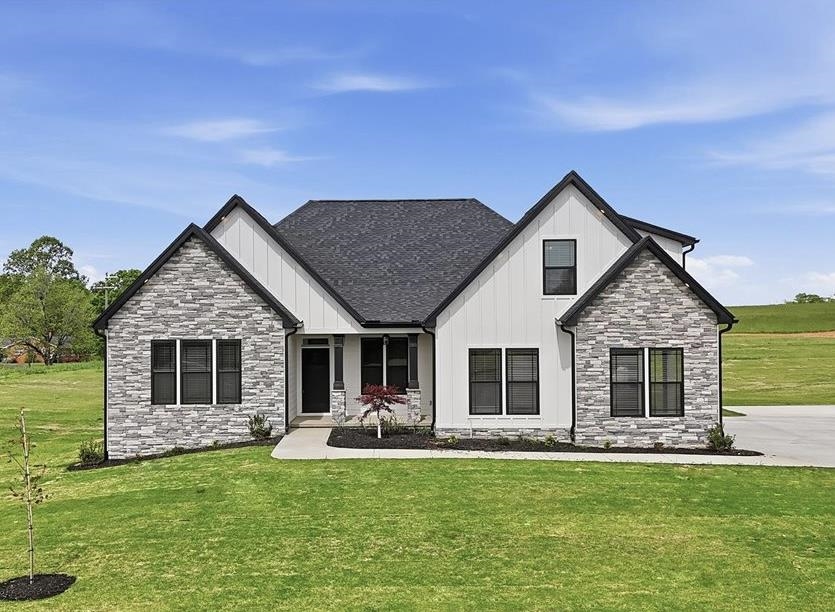 Custom home by local builder on 1.5 acres in Columbus/Greene Creek area! Enchanted Homes' Elite Series. Countless upgrades included. Wall ovens, Upgraded Flooring, Tile Shower w/Frameless Glass Door, Stone Work. Finished Room Above Garage with Bump Out Dormer for extra space. Beautiful views through Living Room, Master and back patio. Extensive trim work and site built columns. Scheduled to be complete around September 2025. The Beumont Elite with site specific customizations. Must See!