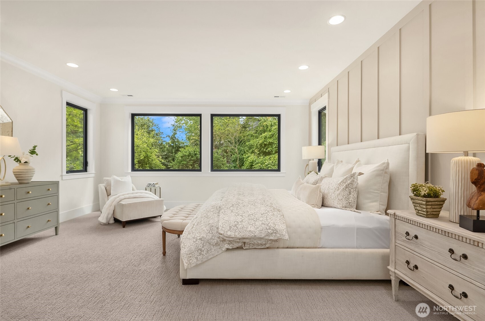 Bright bedroom with large windows.