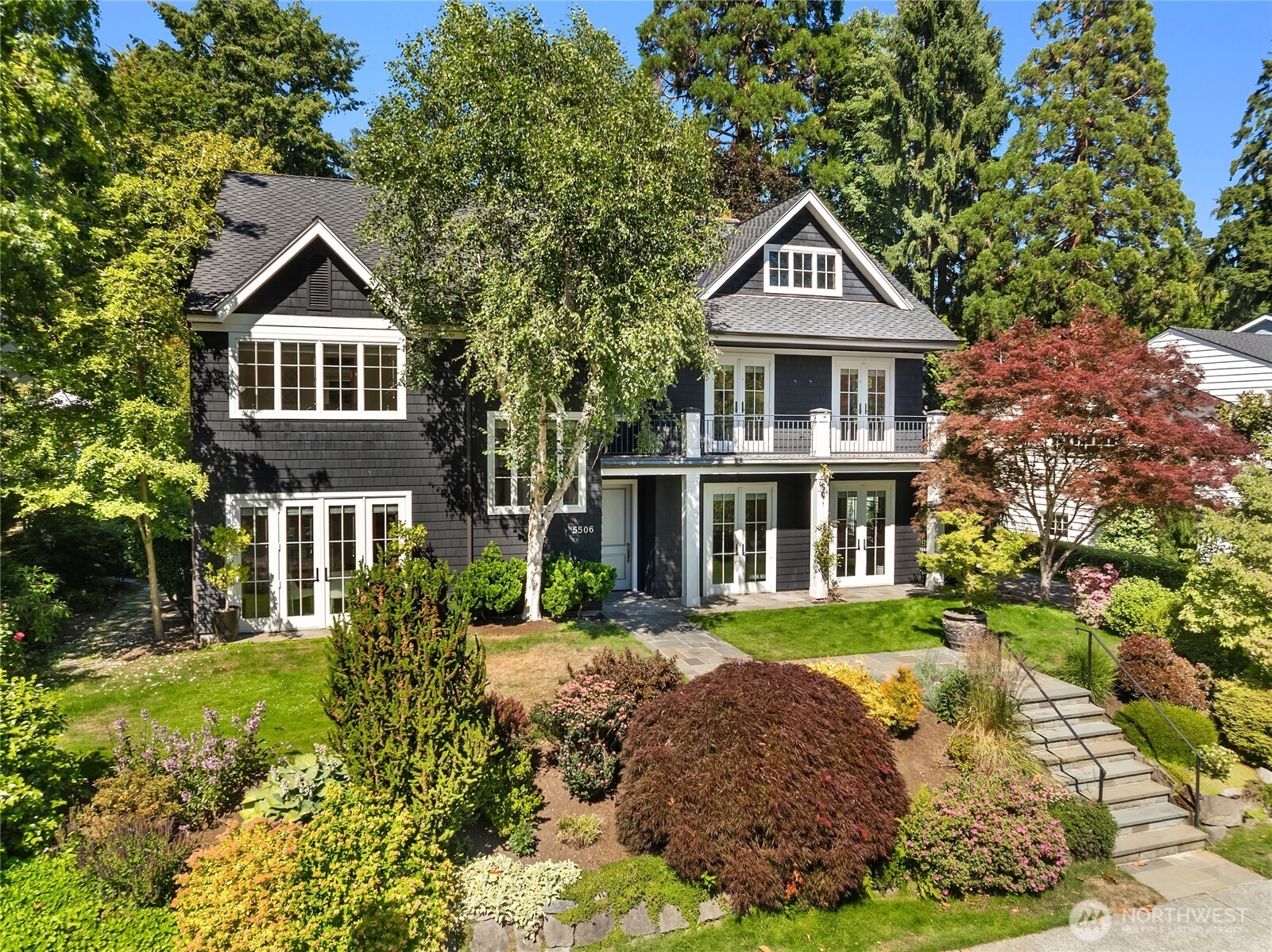 Nestled on a lush, park-like lot in coveted Windermere, this exceptional residence offers timeless architecture, expansive living spaces, and unmatched versatility. Gracious formal living and dining rooms set the stage for elegant entertaining, while the spacious chef’s kitchen flows seamlessly into the inviting family room, creating the heart of the home. With 5 bedrooms and 6 baths, the thoughtfully designed floor plan provides comfort and flexibility for every lifestyle. 4 bedrooms upstairs including the primary suite with built-ins, a 5-piece bath and large walk in closet. The lower level features a rec room, dedicated wine room, abundant storage, and guest bed and bath. Two laundry rooms offer convenience on multiple levels. French doors open to a beautifully designed outdoor entertaining patio featuring a cozy firepit and lush mature landscaping, ideal for relaxing evenings and effortless entertaining. A rare highlight is the detached carriage house, complete with its own kitchen, bath, living area, and loft bedroom—ideal for guests, extended living, home office, or creative studio space. Completing the property is a two-car garage. An extraordinary Windermere offering that seamlessly blends sophistication, function, and enduring appeal.