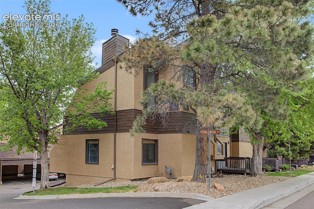 Located in the highly desirable Rockrimmon area, this beautifully updated townhome offers comfort, functionality, and an ideal floorplan. The oversized living room provides an inviting space for relaxing or entertaining, while the full kitchen offers ample room for cooking and gathering. Brand new carpet throughout adds a fresh, modern touch to the home. The main level bedroom provides flexibility for guests, an office, or convenient main-level living. Upstairs, the spacious primary suite features an adjoining bathroom for added privacy and comfort. The finished basement boasts a large rec room perfect for a media area, game room, home gym, or additional living space. One driveway parking spot is included.  Conveniently located near parks, trails, shopping, and dining, this townhome combines low-maintenance living with a prime location in one of Colorado Springs’ most sought-after communities.