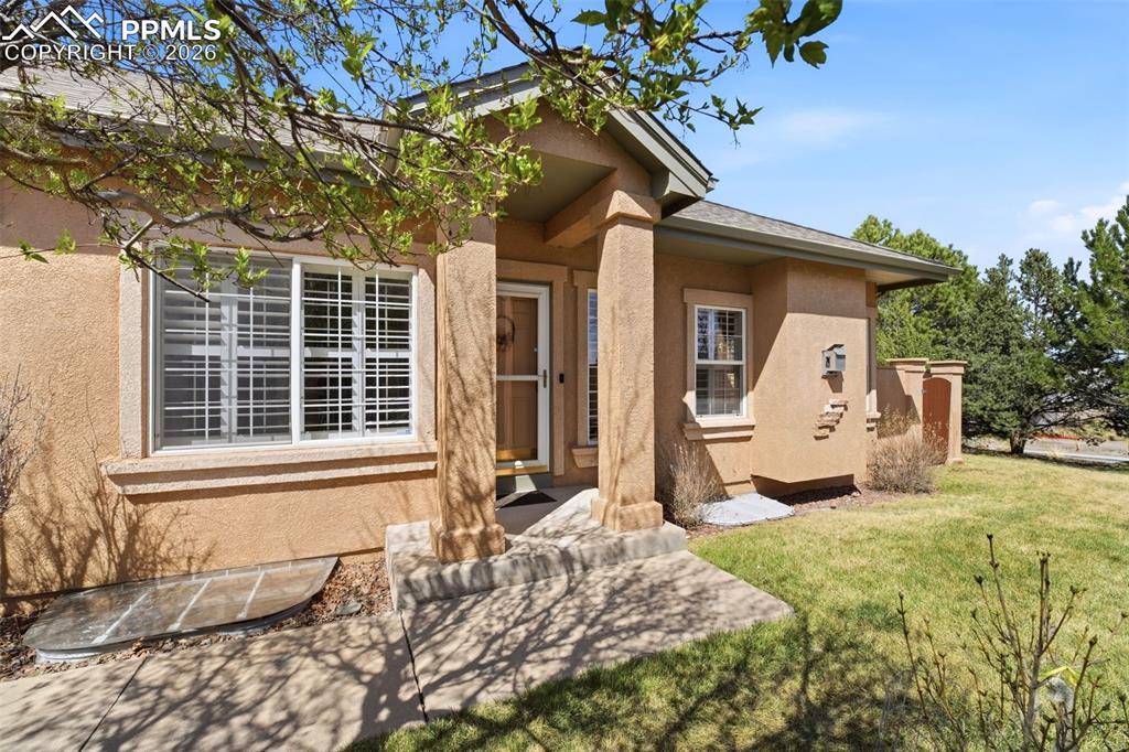 Exceptional opportunity in the coveted University Park area where mature landscapes, open space, and everyday convenience come together * Beautifully maintained ranch style patio home with finished basement offering effortless, low maintenance living in a highly desirable Colorado Springs location with convenient access to shopping, dining, parks & major thoroughfares * Ideally positioned on its lot siding to a large open grassy area that enhances both space and privacy, this home truly showcases pride of ownership from the moment you arrive * Light filled main level features hardwood flooring, vaulted ceilings and custom shutters throughout creating a warm & inviting feel * Spacious great room is anchored by a gas fireplace with tile surround, this space flows seamlessly to a private patio framed by mature landscaping & enhanced by an electronic awning, ideal for relaxing or entertaining * The kitchen is functional with all appliances included, pantry storage, recessed lighting & a comfortable layout for everyday use * Dedicated dining * Main level primary suite offers newer carpet, vaulted ceilings, walk in closet and direct access to the patio, creating a peaceful retreat * Secondary main level bedroom or office is conveniently located next to a full bath and features a new ceiling fan and light * Main level laundry with washer / dryer included is an added bonus * The fully finished lower level expands the home with a generous family room, separate media space, two additional bedrooms, a full bath and ample storage * Home provides flexibility for guests, hobbies, or extended living * Additional highlights include an oversized insulated two car garage with insulated garage door & opener * True main level living paired with a peaceful setting offering both privacy & accessibility * Located in the desirable area with nearby parks and trail access, this is a rare opportunity to own a truly move in ready home in a well established and sought after community * Hurry...