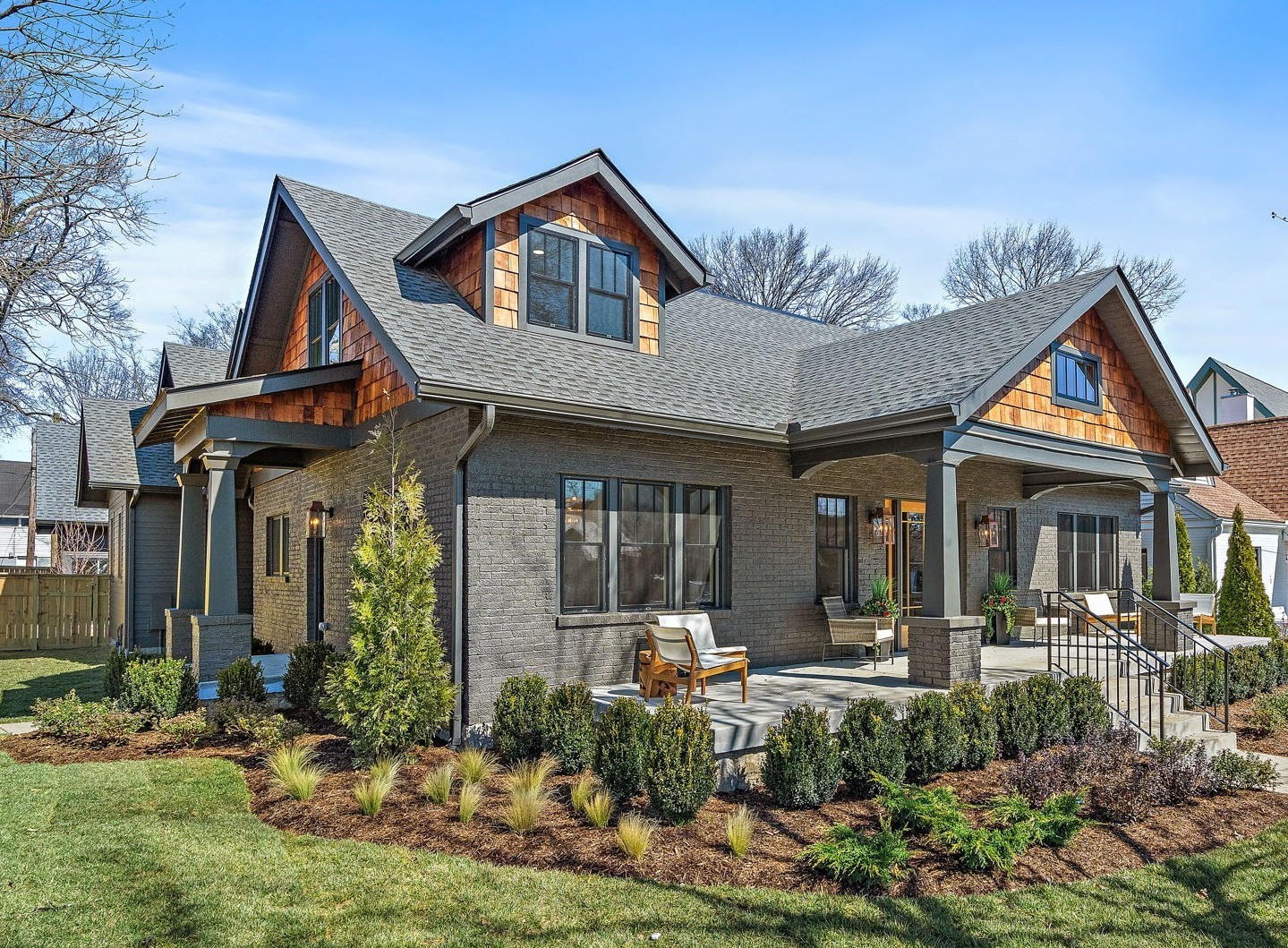 Welcome to 926 Bradford Avenue! This stunning 6-bed, 6-bath home seamlessly blends modern elegance with timeless charm, offering exceptional living in the heart of 12 South --- one of Nashville's most sought after neighborhoods. This meticulously crafted home offers 4 bedrooms and 4.5 bathrooms in the main residence, plus a 2 bed, 1.5 bath Detached Accessory Dwelling Unit (DADU)—perfect for guests, rental income, or a private office space. Step inside to discover elevated designer finishes, an open-concept living area, and abundant natural light. The chef’s kitchen boasts high-end appliances, including a gorgeous La Cornue double oven/range, custom cabinetry, and a large island--ideal for entertaining. The spacious living and dining areas flow effortlessly, anchored by a cozy fireplace and expansive windows. The luxurious, main level primary suite features a spa-like bath and two generous walk-in closets. Upstairs, you will arrive to find a spacious bonus/media room with a reading nook, as well as an additional laundry room and spacious storage closet. Each second level bedroom is its own private sanctuary, complete with ensuite bathrooms and walk-in closets. Additional highlights include a dedicated home office and a designer finished wet bar complete with a wine cooler and butler's pantry. Outside, enjoy a covered front porch, as well as a large covered rear porch overlooking your beautifully landscaped backyard retreat. The DADU offers a perfect space for extended family, short-term rentals, or a creative workspace. In addition to the 2 bed, 1 bath apartment upstairs, there is a large flex space on the main level equipped with cabinetry, a sink, and a half bath perfect for a home fitness studio, music studio, or craft room. Located just steps from 12 South’s top restaurants, boutiques, and coffee shops, this home combines modern luxury with unbeatable walkability. This is your opportunity to own a showpiece in one of Nashville’s premier neighborhoods!