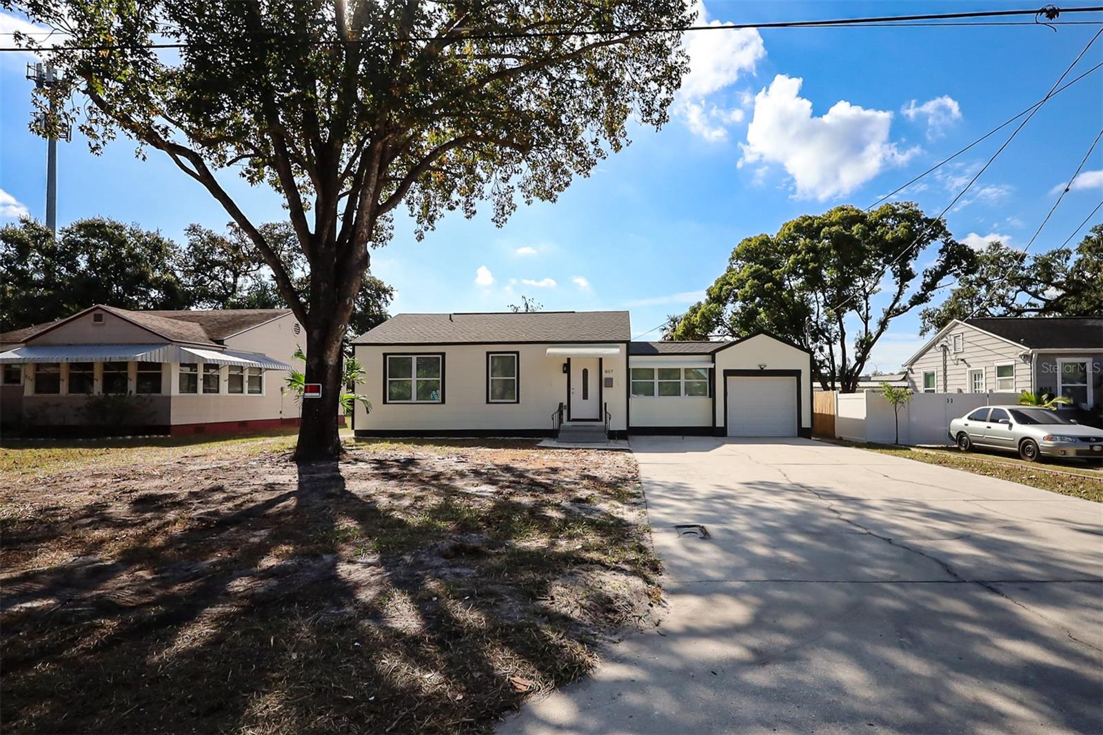 Virtually Staged. WELCOME TO 807 E NORFOLK ST! Take a look at this completely remodeled gem! This adorable 2-bedroom, 1-bath home is located in a quiet neighborhood and sits on a HUGE LOT! Updates include a brand-new roof in 2025, all-new windows, new electrical and plumbing, brand-new solid wood kitchen cabinets with a beautiful quartz countertop, and new appliances! The home also features an attached GARAGE, great for anyone with a hobby, or to store your classic vehicle! A super cute back porch where you'll get to enjoy beautiful sunny days! Lots of potential with a 9,815 SQ FT lot!  No flood zone here! Act quickly and make this gem yours today!