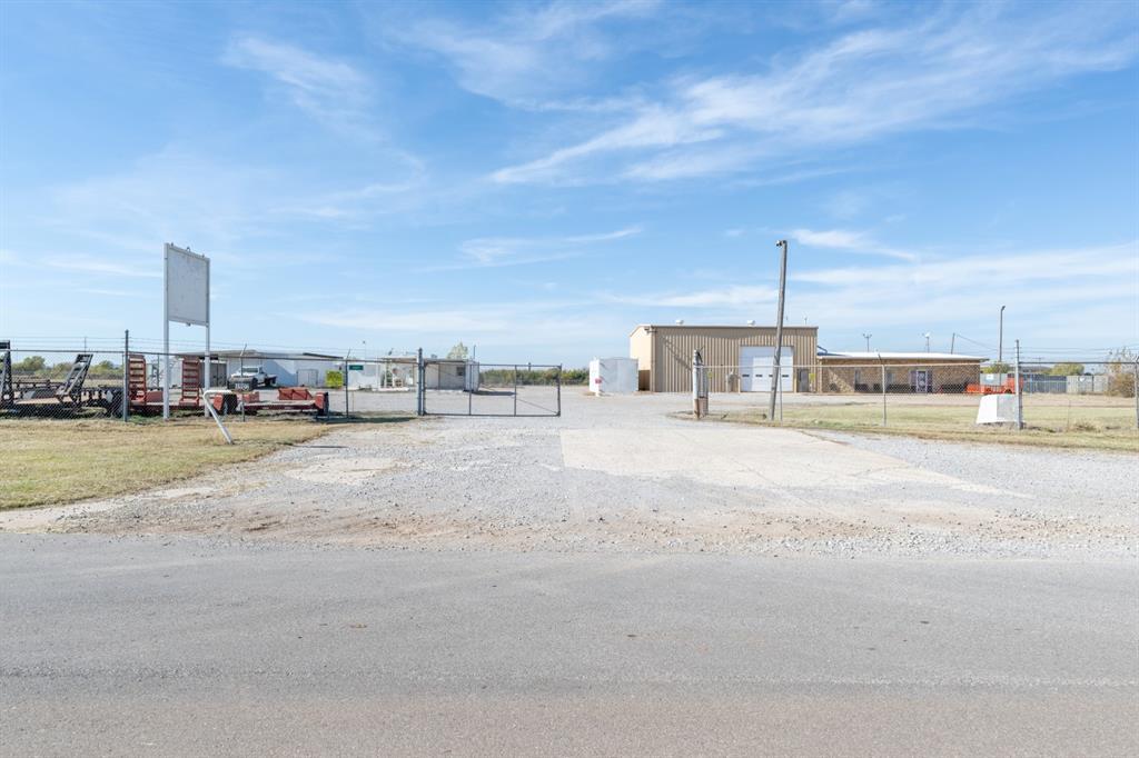 9.755-acre I-2 zoned industrial site with a &#177;5,000 SF building (2,000 SF office, 3,000 SF warehouse). Fully fenced, level lot with city water and sewer. Clear-span warehouse with overhead doors. Prime location less than 1 mile from I-240 and minutes to I-44/Turner Turnpike and the airport. Ideal for trucking, manufacturing, distribution, contractor yard, outside storage, and future growth/development.Rare combination of nearly 10 acres, city utilities, and quick highway access. Contact for more information.