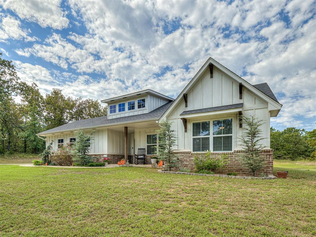 This modern farmhouse offers a split floor plan with a separate wing for secondary bedrooms, providing privacy and functionality. The open living area features a cozy fireplace and flows seamlessly into the dining and kitchen spaces with beautiful finishes throughout. The spacious primary suite includes a large walk-in closet that conveniently connects to both the bedroom and laundry room. Secondary bedrooms are in their own private wing and also have access to the laundry room. Enjoy peaceful country living on 2.01 acres. Below ground tornado shelter on property for peace of mind. Blending comfort, charm, and practicality, this property is perfect for those looking for a serene lifestyle with modern conveniences. Fast food and grocery within 5 minutes, or Norman/Harrah 20 minutes away.