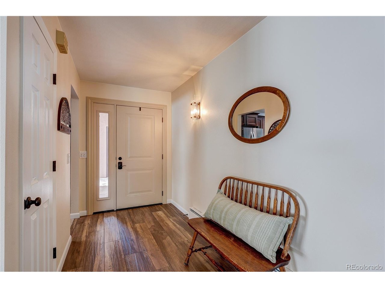 Experience effortless mountain living in this beautifully remodeled end-unit row home, ideally located just three blocks from downtown Estes Park with stunning views of Longs Peak and the snow-capped Continental Divide. This low-maintenance, 2-bedroom, 2-bath home offers the best of both convenience and adventure, with downtown shopping, dining, the Stanley Hotel, Lake Estes, walking trails, golf, fishing, kayaking, hiking, and biking all just minutes away. This rare end unit offers desirable main-level living, an oversized two-car garage, and exceptional outdoor space featuring a large fenced wraparound patio and side yard set against .17 acres of open space-perfect for taking in breathtaking mountain views or relaxing after a day of adventure. Inside, you'll find a thoughtfully updated open floor plan with a spacious great room featuring a native stone gas fireplace, a designer kitchen with granite countertops, new cabinetry, updated appliances, and a flexible dining area that could also serve as a home office. The primary suite includes patio access, a large walk-in closet, and a beautifully remodeled 3/4 bath with a walk-in shower. Extensive upgrades make this home truly move-in ready, including new heating, Andersen windows and doors, woodwork, appliances, paint, carpet, sinks, toilets, faucets, cabinets, countertops, lighting, custom window coverings, pine needle-proof gutter guards, and a gas fireplace. With no HOA, low-maintenance living, and an unbeatable location, this turnkey property is ideal as a full-time residence, weekend retreat, or seasonal mountain getaway. Park your car, unpack your groceries, and head straight for the trails-mountain living doesn't get easier than this.