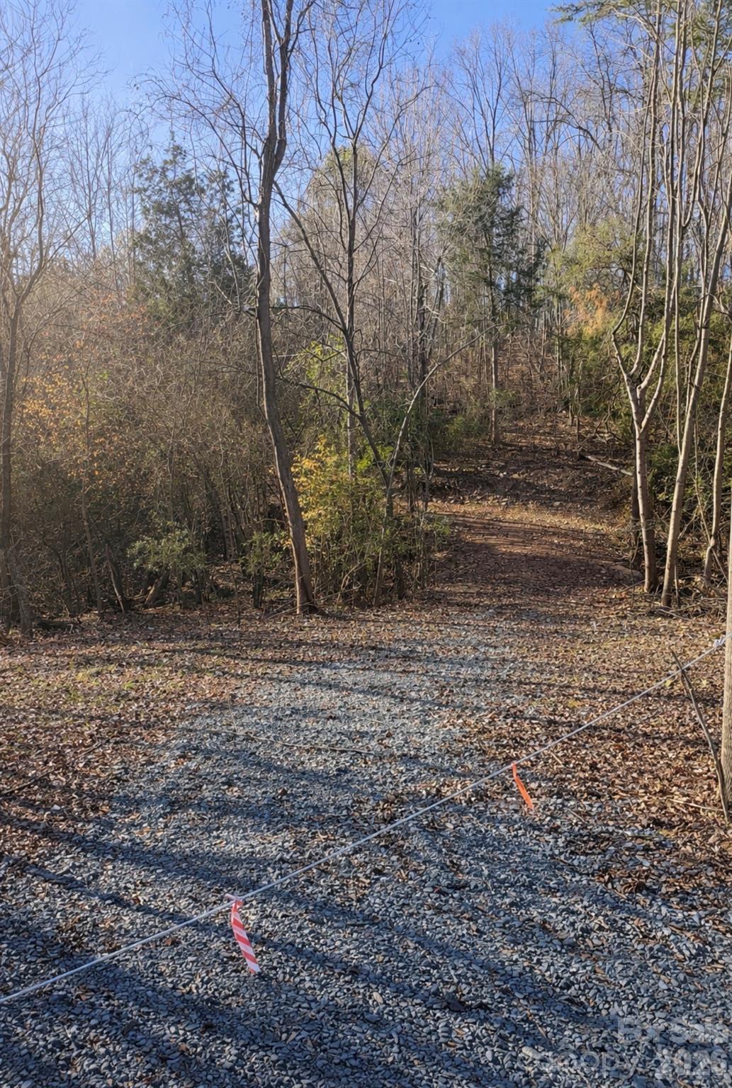 If you’ve been searching for space, privacy, and natural beauty, this 15-acre wooded property delivers it all. With a newly installed driveway, accessing and walking the land is easy, allowing you to fully experience its potential. Situated outside city limits, the setting feels like a mountain escape, complete with a creek at the lower end of the property. Whether you envision a secluded estate, a family compound, or multiple home sites, this land offers the freedom and flexibility to bring your vision to life.