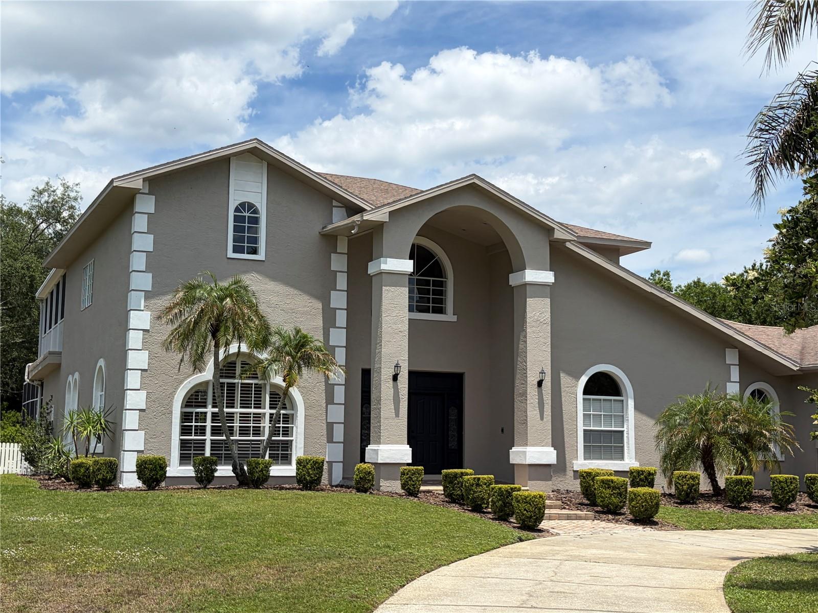 Do not miss this very rear opportunity! Situated on a quiet cul-de-sac, this stunning updated luxury estate sits on nearly one acre and offers a rare combination of lots of privacy, space, and comfort in one of Tampa Bay's most desirable upscale neighborhoods. Surrounded by a wooded buffer on one side and privacy fences from the neighbors on the other side and the rear, this property provides a peaceful, private setting that is incredibly hard to find. With no through traffic and a spacious homesite, this home delivers a true sense of seclusion while remaining conveniently located near shopping, dining, and top-rated schools. Inside, this home offers over 4,100 square feet of thoughtfully designed living space, including 5 bedrooms with walk-in closets and 5 full bathrooms. The layout includes multiple living and entertaining areas, creating flexibility for both everyday living and hosting. The outdoor living space is equally impressive, featuring a screened-in oversized pool and spa, an oversized lanai, and expansive yard space with room to relax and entertain. Additional highlights include a 3-car garage and a functional layout designed to accommodate a variety of lifestyles. Opportunities like this - offering nearly one acre estate in one of the most desired upscale luxury neighborhoods of Tampa Bay in a top-rated school district, tons of privacy, and an updated home within a cul-de-sac setting - are extremely rare in this area. Do not miss owning this rare gem!
