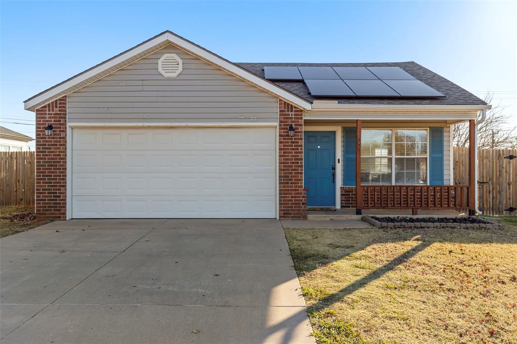 Priced under $200,000 with no HOA, this adorable 3-bedroom, 2-bath home offers easy access to I-35, Tinker AFB, shopping, entertainment, restaurants, parks, and more. Cute curb appeal welcomes you with an inviting front porch and charming blue shutters before leading into a spacious layout featuring high ceilings in the living room, perfect for entertaining. The kitchen is ideal for all your culinary needs with ample cabinet and counter space, and the dining area is spacious with glass sliding doors that open to the backyard for easy indoor-outdoor living. The laundry room located just off the kitchen adds convenience and functionality for everyday routines. The home includes freshly painted secondary bedrooms, new ceiling fans and outlets, a water heater replaced around 2023, and a 2021 roof. Solar panels offer added energy efficiency to help keep utility costs low. The above-ground storm shelter located inside the garage is perfect for storm season and provides protection for 6–8 people. The bedrooms are generously sized with great closets, and the primary suite features a charming barn door leading to the full primary bathroom. The fully fenced backyard offers plenty of space along with an open patio for outdoor enjoyment. Located just ten minutes from the University of Oklahoma campus, this cute and well-maintained home is ready for its next owner.