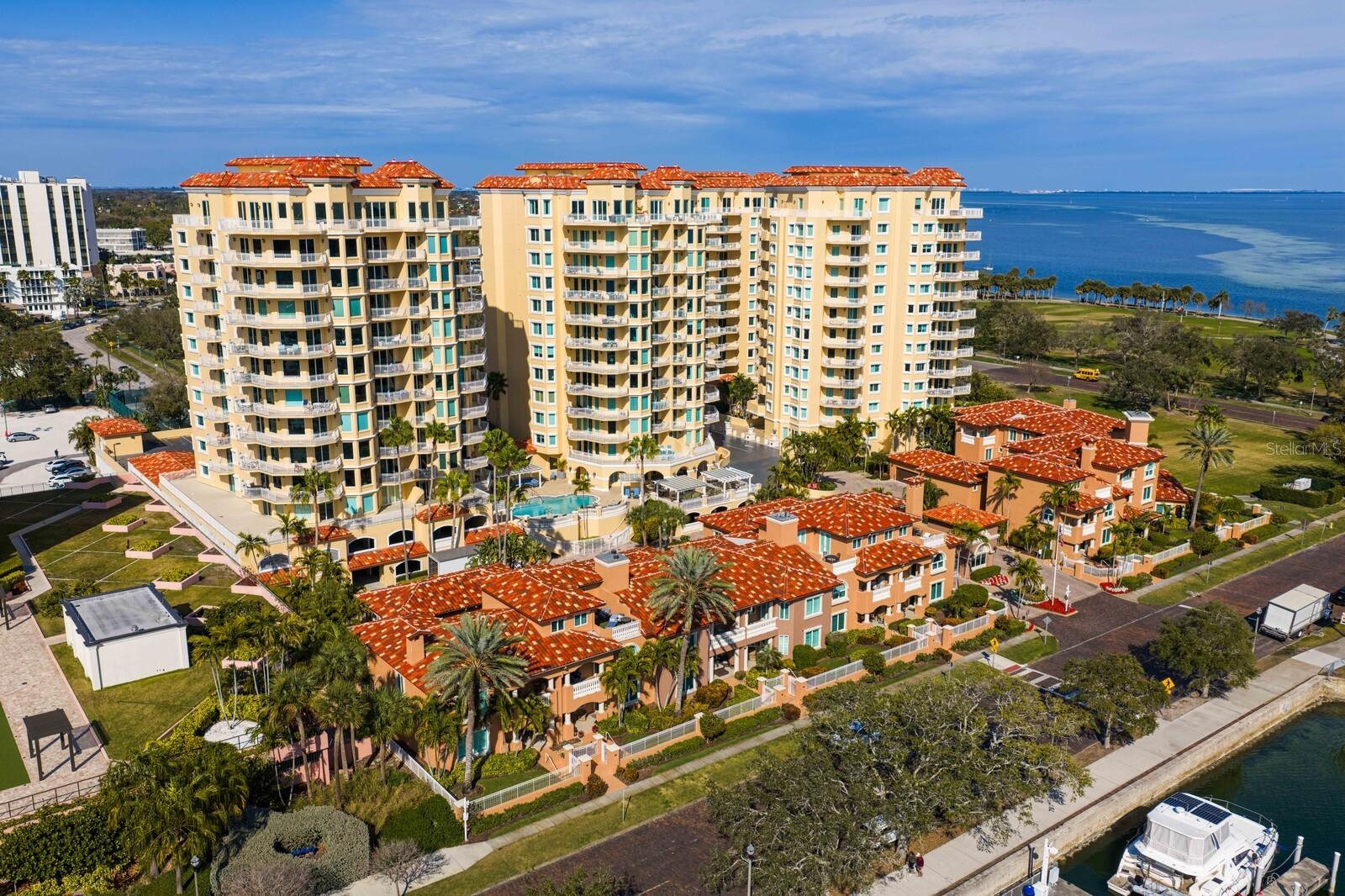 Where sky meets sophistication.This coveted penthouse at the Vinoy commands breathtaking, panoramic vistas that sweep across the St. Pete Pier, Albert Whitted Airport—where private aircraft arrive and depart—the Vinoy Marina, and the glittering downtown St. Petersburg skyline. Soaring 10-foot ceilings, full-height sliding glass doors, and expansive wraparound balconies frame the views while bathing the interiors in natural light. Move-in ready and professionally designed by Steven Anthony Luxury Homes, the residence offers a seamless blend of refinement and comfort.Spanning approximately 5,300 square feet, this trophy home features three bedrooms, three-and-a-half baths, and a work-from-home den that easily converts to a fourth bedroom. Designed for effortless living and entertaining, the chef’s kitchen opens to the great room and features European-style Allikriste Custom Cabinetry, quartzite countertops, and an exceptional suite of appliances—including Wolf warming and dish drawers; Sub-Zero refrigerator, freezer, and compact refrigerator; and a Fulgor Milano induction range. A discreet prep kitchen with sink and dishwasher ensures effortless entertaining.Solid oak hardwood floors run throughout, complemented by a dramatic, floor-to-ceiling 100-bottle wine wall and a bespoke cocktail bar designed to take in the views. The primary suite is a true retreat, offering a fireplace, Tampa Bay views, an expansive walk-in closet, and a spa-inspired bath with soaking tub, oversized glass shower, dual vanities, and a private water closet. Two additional guest suites feature custom closets and beautifully appointed en-suite baths. The den enjoys patio access, adding flexibility for living or hosting.Renowned for its exclusivity, the Vinoy delivers resort-style amenities including two heated pools, a 24/7 manned guardhouse, a state-of-the-art fitness center, a club room, and ample guest parking. Just steps from world-class dining, museums, and cultural attractions, this is downtown living at its most elevated.