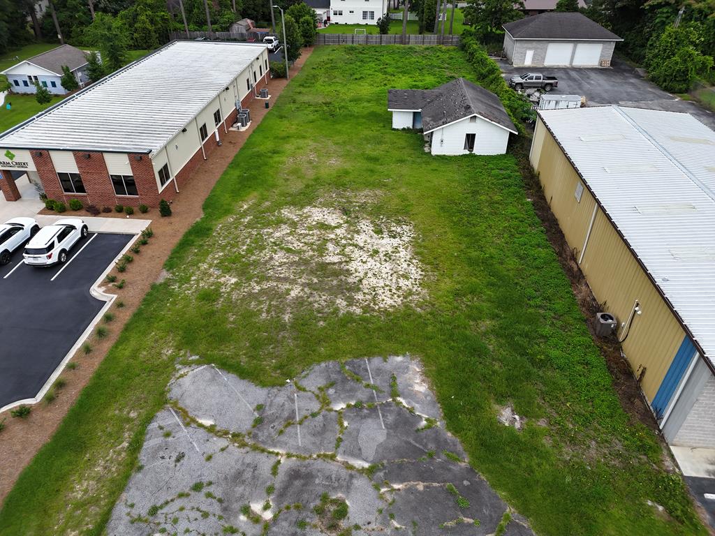 Commercial Lot in established commercial area of East Jackson Street, ready for a new owner's vision for their business.  Lots of activity in the area, good traffic count and visibility.  Property does have an old building on the property that could be restored for a commercial space or a tear down for a new build.  Desirable area with very limited availability.