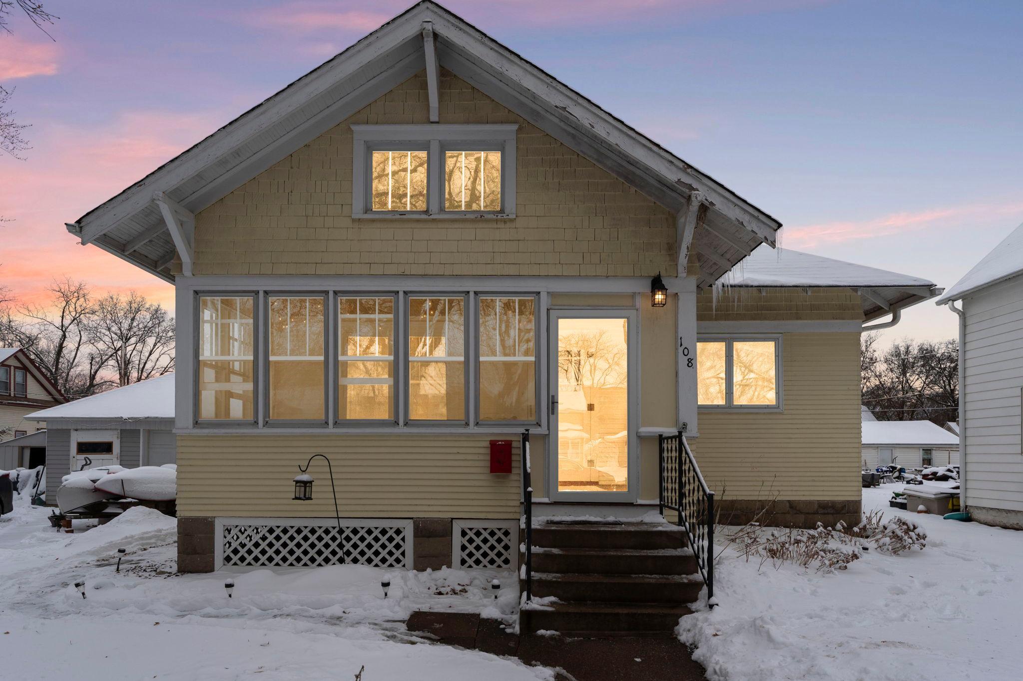 Charming 3-bedroom, 2-bath home on a peaceful, tree-lined street in Jordan. Enjoy a spacious front three-season porch and a back three-season porch with walls of windows for indoor-outdoor living. The living room features maple hardwood floors, an electric fireplace, and a closet, flowing into a formal dining room with built-in china cabinet. The kitchen offers ample cabinetry, a tile backsplash, and a bright breakfast nook with deck access. Two main-level bedrooms include the primary with walk-through access to the shared full bathroom, plus additional hallway storage. Upper-level space is flexible for an extra bedroom, office, or hobby room. The finished lower level includes a family room, bar area, the 4th non-conforming bedroom, three-quarter bathroom, laundry with folding table, utility room, and built-in workbench. Enjoy a large deck and two-car detached garage. Don’t miss out on this charming home nestled in the quiet town of Jordan.
