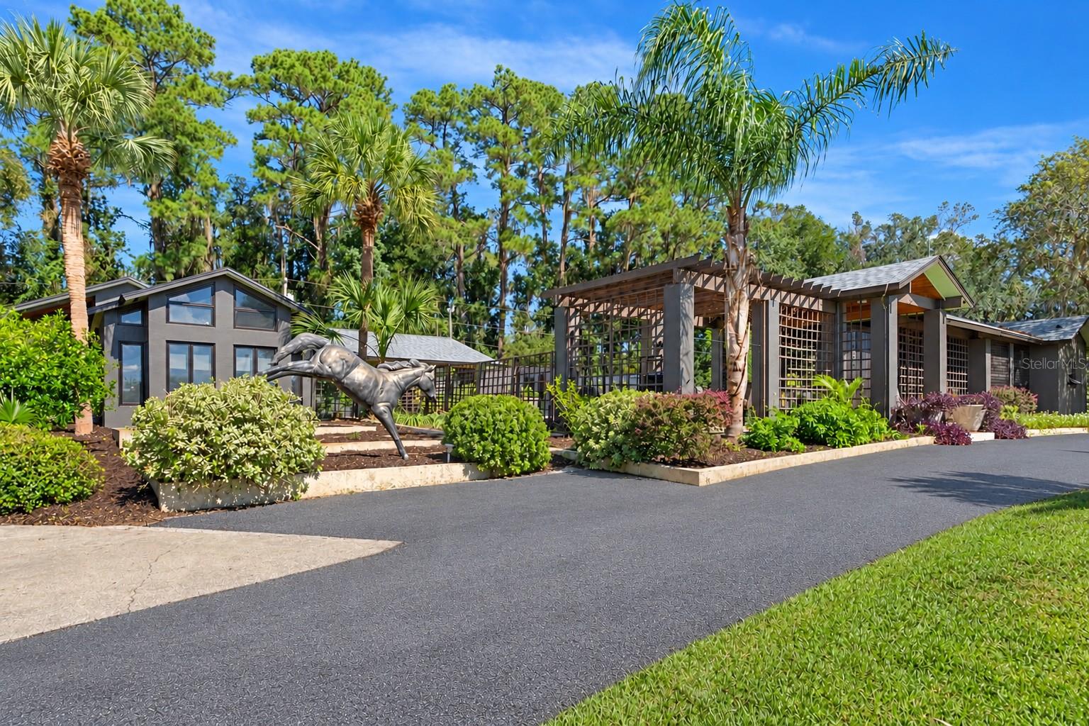 STATE-OF-THE-ART KENNEL & PRIVATE COUNTRY ESTATE NEAR WORLD EQUESTRIAN CENTER! Rare opportunity to own an exceptional, professionally constructed block kennel and private estate just minutes from the WEC and I-75. Built in 1990, the 13-unit indoor/outdoor kennel was designed for safety, sanitation, and functionality. Kennel features include epoxy-finished walls and floors, individual floor drains, secure Mason kennel panels, steel doors, a dedicated birthing room, spacious puppy accommodations, laundry area, bathing sink, and a separate bathroom. The impressive 29' x 20' main lobby of the kennel boasts 20' ceilings, offering ample space for training and handling. NEW 4.5-ton HVAC unit (2026). Separate commercial electric service and septic system. Construction blueprints and kennel inspection documentation are available. The established 48-year West German Shepherd breeding business, including titled, DNA-verified pedigrees, is negotiable. A rare opportunity for established breeders or those looking to create a premier kennel facility. Boarding use requires applicable zoning board approvals. Enjoy the privacy of country living with resort-style amenities on this gated estate. The residence is designed by architect Walter R. Baker Jr. and built by contractor James Bowden in 1990. Both Kennel and residence feature wired for backup generator, lightning rods. Inside, vaulted wood ceilings and expansive windows bring tons of natural light into the living spaces. The gourmet kitchen is designed for entertaining, featuring an oversized quartz island, smart appliances, including double dishwashers and refrigerators, plus generous prep space and seating. Three en suite bedrooms ensure comfort and privacy. The primary suite offers a sitting area, walk-in closet, an updated bathroom, private laundry room, and outdoor access to a gazebo and fenced outdoor retreat. Enjoy the Florida lifestyle with a swimming pool, casita, and covered outdoor entertaining areas. The 10-acre grounds are perimeter-fenced, with ample pasture for horses, cattle, and other animals, plus a large fenced garden and established fruit trees. Multiple outbuildings provide flexibility for guests, extended family, worker accommodations, hobbies, or potential business uses. Recent improvements to the residence include roof new in (2022), fresh paint, and professional landscaping. Additional features include a deep well with an owned water purification system, multiple septic systems, a climate-controlled attached extra-deep two-car garage, multiple sheds, covered RV parking with RV hookups and cleanouts, and extensive parking for vehicles, trailers, and equipment. Elevated topography offers scenic views of rolling pastures and mature trees. This property offers a peaceful, secluded setting, with shopping, restaurants, private jet airport, and major destinations, including Ocala, Gainesville, Orlando, and Tampa, all accessible via nearby I-75. A truly distinctive property combining specialized kennel facilities, established business potential, acreage, and private estate living in one remarkable offering