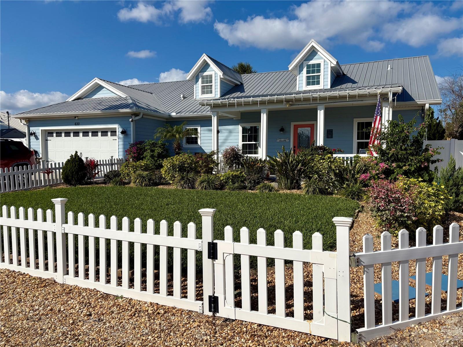Experience relaxed coastal living in this updated 3-bedroom, 2-bath home just four blocks from the beach and Flagler’s best restaurants. The open layout offers views of the Intracoastal Waterway and plenty of space for everyday living and entertaining. An oversize wooden dock with a 6,000-lb boat lift includes water, electricity, and a cleaning station. It’s an ideal spot for sunsets, morning coffee, wildlife watching, or casting a line. Perfect for boaters, fishermen, kayakers, and jet-skiers. The garage has room for cars, a golf cart, bikes, surfboards, fishing gear, and more. Inside, the bright kitchen features KitchenAid stainless steel appliances, a pantry closet, and an island that opens to the living area. A stone gas fireplace anchors the space, and luxury vinyl flooring and updated lighting tie everything together, includes integrated Bose 5.1 surround system. The dining area sits just off the kitchen and can accommodate an oversized dining table.  A separate laundry room includes an LG top-load washer and dryer plus storage cabinets. All bedrooms include closet systems, and the primary suite adds an extra-large walk-in closet. Step outside to a spacious enclosed lanai with a saltwater pool and pergola. The saltwater filter was recently replaced. Smart-home features include whole-house WiFi-enabled garage door control, an entry system, and Rain Bird sprinkler controls. Recent upgrades: 1. Hurricane-rated patio doors 2. Screened lanai 3. Fenced front yard with new sod 4. Irrigation systemA four-foot stem wall was added to reduce insurance costs; flood insurance is under $900 annually.Additional improvements: 1. New pool pump (2023) 2. Outdoor security camera system (11 cameras) 3. A/C replaced in 2023This home sits in the heart of Flagler Beach, a small coastal town known for its friendly, Old Florida feel. Local boutiques, surf shops, oceanfront restaurants, and weekly markets are all close by. Cruise downtown in your golf cart, watch the sunset from the pier, or grab coffee at a neighborhood café. With smart-home conveniences, storm-ready features, and true waterfront living just steps from the sand, this home offers the best of Florida’s east coast. Move in and start enjoying the lifestyle right away.