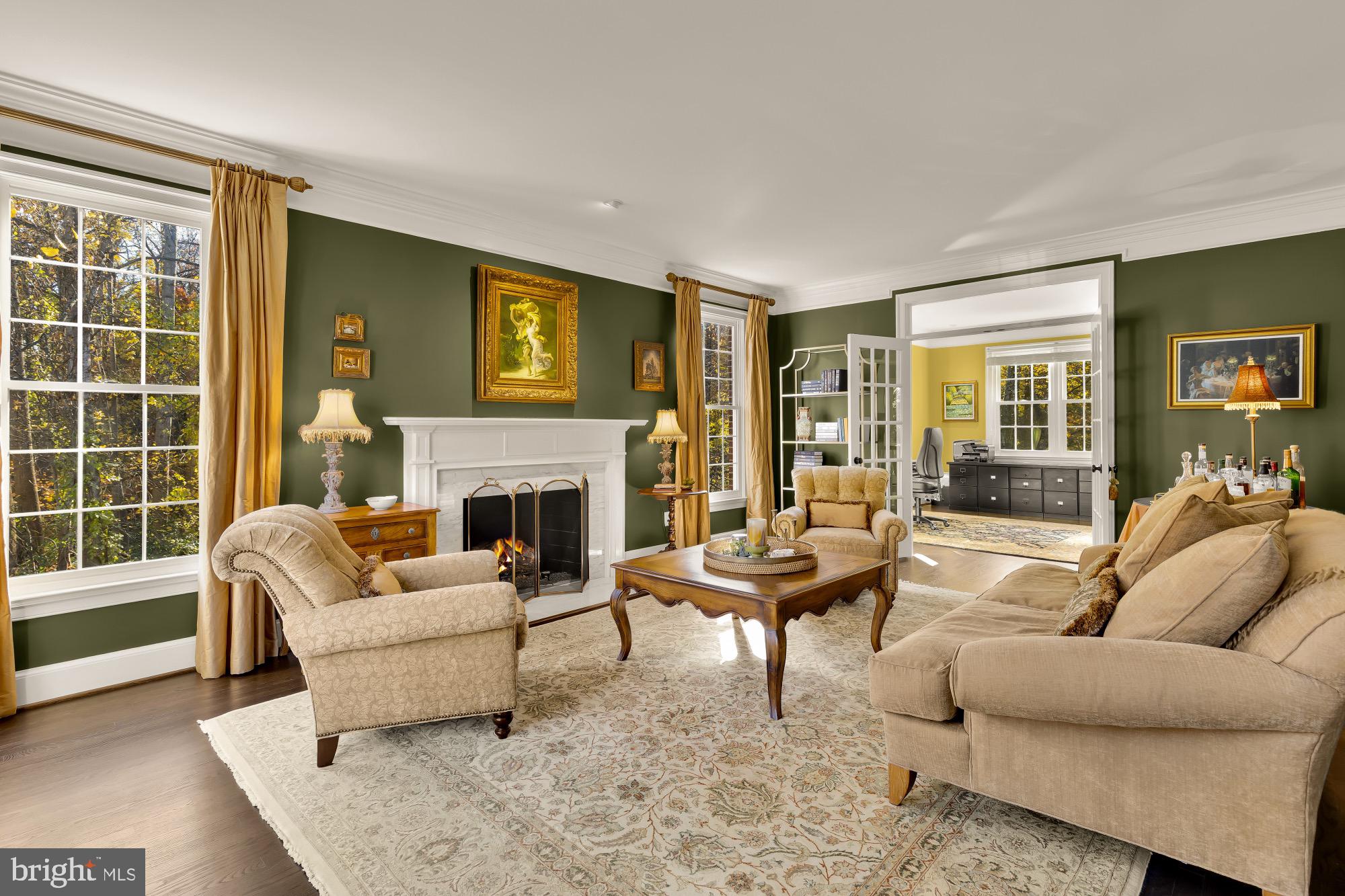 Welcome to 1257 New Bedford Lane, just 8 miles from Dulles International Airport, it’s a gracious, fully renovated home with six-full sized bedrooms, 5 full size bath and 2 half bathrooms, all with wooden floors throughout. It’s tucked at the end of a quiet cul-de-sac surrounded by mature trees and natural beauty.     •   From the moment you arrive, this home feels special. The classic brick façade, private wooded backdrop, and abundant natural light create a perfect blend of elegance and warmth.   •   MAIN LEVEL:Step inside a two-story foyer that opens to a beautifully proportioned elegant living room with gas fireplace and a dining room, ideal for both large and small gatherings. The heart of the home is the sun-filled family room where vaulted ceilings, and large windows provide all day sunlight.  An open stone fireplace invites you to relax with a cozy wood burning fireduring the winter months. French doors open to a spacious deck overlooking the  backyard, an ideal spot for morning coffee or entertaining with wood burning chimney for cooler evenings.A spacious private office with bay windows overlooking the wooded area and large powder room complete the main level with the kitchen.   •   KITCHEN:The kitchen is designed for both style and function with granite countertops. Viking appliances, Sub Zero Fridges & Freezer, custom cabinetry, instant hot water & water filter, sensor faucet and acheerful breakfast area framed by large walk out glass doors that lead to the south facing deck. The kitchen leads to a convenient laundry room & closet and a custom 2 car garage.   •   UPPER LEVEL:Upstairs, the primary suite feels like a private retreat with a sitting area, his and hers dressing rooms, a spa-inspired marble bath, separate toilets, large shower and generous closet and storage space.Three additional full bedrooms with storage closets, and two baths (one is  Jack & Jill) ensure access for all bedrooms & plenty of room for family and guests.   •   LOWER LEVEL:The walk-out lower level provides wonderful flexibility with two large primary bedrooms,  a large recreation room with gas fireplace, a fitness area with a half bath, a cedar wine cellar and two fullsized storage areas. It is the perfect setting for game nights, movie marathons, chill weekends or hosting out-of-town visitors.   •   OUTDOORS:Enjoy outdoor living from the upper deck or the covered patio below, surrounded by mature trees and peaceful views. Located just 2 miles from Reston Town Center with a host of goodrestaurants, Wiehle & Reston Metros, several lakes with scenic running & walking trails, 18 outdoor pools & 48 Tennis courts.   •   This home offers the best of both tranquility and convenience in one of Reston’s most desirable and sought after neighborhoods.