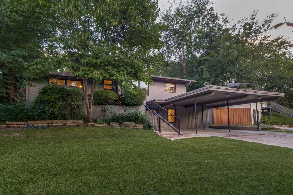 Located in North Oak Cliff’s beloved Wynnewood neighborhood, this home blends modern design with mid-century flair in a way that feels both elevated and inviting. Perched on a dramatic hillside lot, the approach alone sets the tone, while the backyard offers a rare private retreat complete with a pool and serene surroundings.On the main level, an eat-in kitchen overlooks the dining area and steps down into a fabulous living space anchored by a stacked stone fireplace. All bedrooms are generously sized, both baths have been updated, and the expansive bonus living area below offers endless flexibility for work, play, or both.