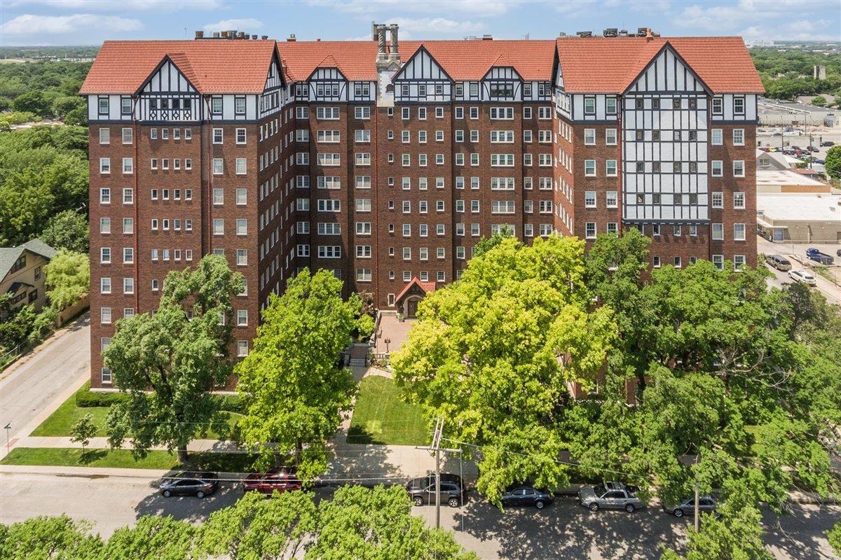 This charming co-op houses apartment beams of its vintage nature. Elegant surroundings and appointments. If you have an appreciation for historic homes, you've stumbled in to the right place. Top floor has a sunroom that views the western sky and downtown Wichita. Main floor fireplace and lovely ambiance. As an owner you own shares of the building. This unit features bright ambiance.  This apartment is 47 shares of the Hillcrest building with a monthly HOA fee of  $805   . The dues cover exterior maintenance and insurance; 24 hour security; basic utilities and property taxes. Covered Parking, if available, is an additional $105 per month. Valet parking. Additionally package /grocery delivery to your door. Work out room and laundry in the shared basement accessible to co-op unit owners. Sky room available for entertaining , top floor with fabulous city views & full kitchen. No pets is building policy. There is also a guest room that owners can reserve for houseguests. Building roof was replaced in 2008, covered by HOA dues. Property being sold in present condition "as is where is without representation or warranty."