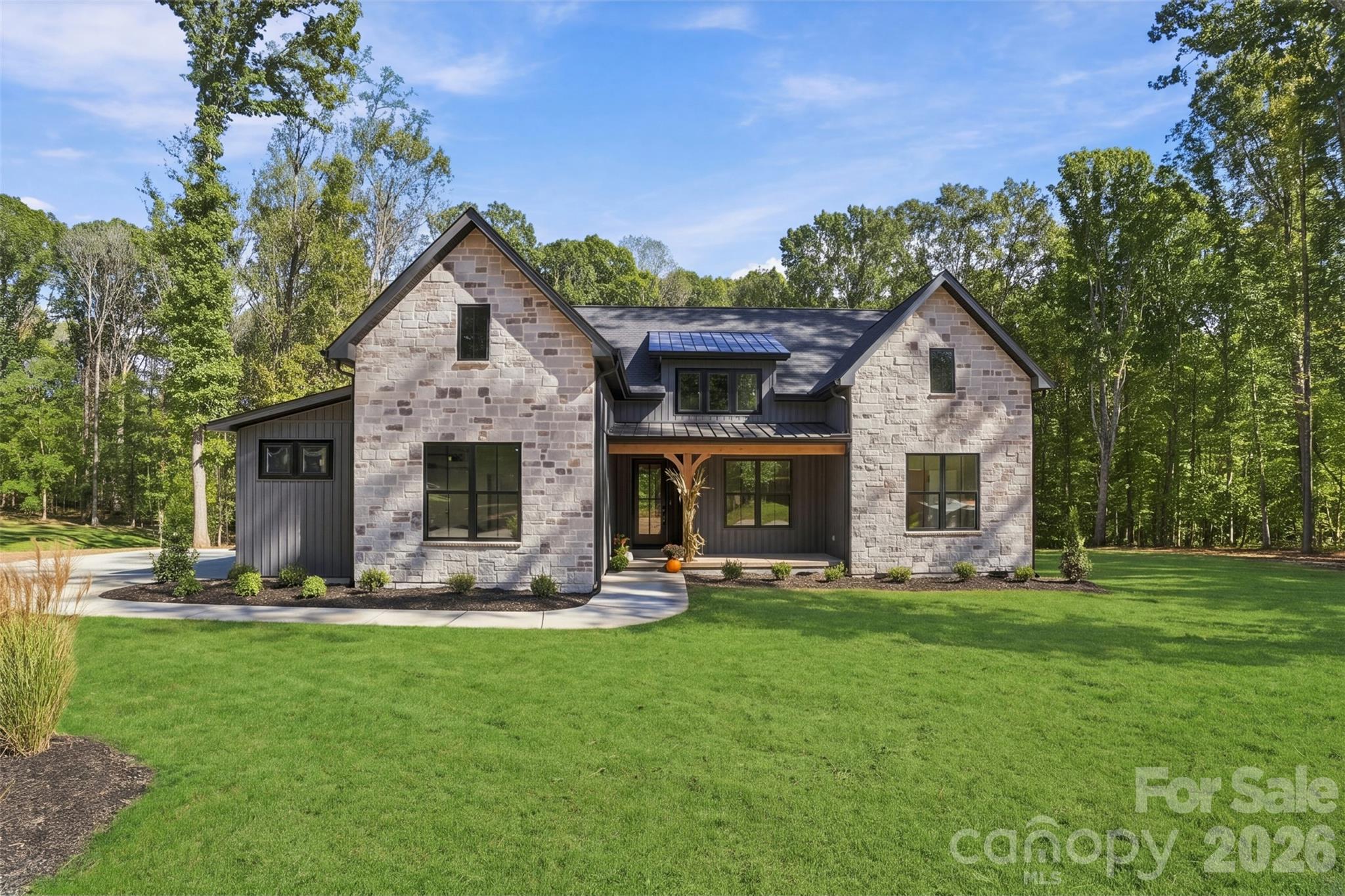 Welcome to 219 Barra Drive in desirable Aubert Landing, just 5 minutes from downtown Waxhaw. This new construction custom home by Sheets Custom Homes showcases quality craftsmanship, thoughtful design, and upscale finishes throughout. The open-concept floor plan features 10’ ceilings in the main living areas, 9’ ceilings in bedrooms, and vaulted ceilings that enhance the home’s bright, spacious feel. The expansive great room seamlessly connects to the kitchen and dining area—perfect for everyday living and entertaining.The chef’s kitchen is appointed with white farmhouse sink, quartz countertops, stainless steel Kitchen Aid appliances and high-end cabinetry with custom hood vent. A versatile bonus/game room offers flexible space for a media room, home office, or playroom. This home includes 4 bedrooms and 3 full bathrooms (one Jack and Jill) across approximately 2,769 square feet. Custom shelving and millwork in all bedroom closets, laundry and pantry. Enjoy outdoor living with a covered rocking chair front porch and an oversized covered rear porch with TREX overlooking a backyard ideal for a future pool. The exterior features stone accents for timeless curb appeal. Situated on nearly an acre with NO HOA, this home offers both privacy and convenience to shopping, dining, and everything Waxhaw has to offer.Ask about a lender credit up to $6,500 from our preferred lender, Jon Ramsay with Mutual of Omaha Mortgage, that can be used towards a temporary rate buy-down or closing costs.