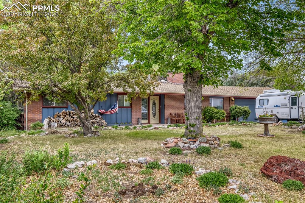 Beautiful ranch-style home on a private half-acre lot in a quiet, upscale cul-de-sac! This 5-bedroom, 2-bath home features new carpet, fresh interior paint, new double-pane windows, and added attic insulation.  Enjoy two cozy wood-burning fireplaces, a walkout basement with a remodeled bath, and flexible bonus rooms for storage or additional bedrooms. Stay comfortable year-round with central A/C, humidifier, electric air filter, and water softener.  The backyard is a true retreat with a deck, pergola, koi pond, shed, and mature landscaping—plus a heavily treed extension with a stream, wildlife, and mountain views!  Great southwest location near shopping, dining, hiking, and Fort Carson. A rare find with space, privacy, and potential!Click the Virtual Tour link to view the 3D walkthrough. Discounted rate options and no lender fee future refinancing may be available for qualified buyers of this home.