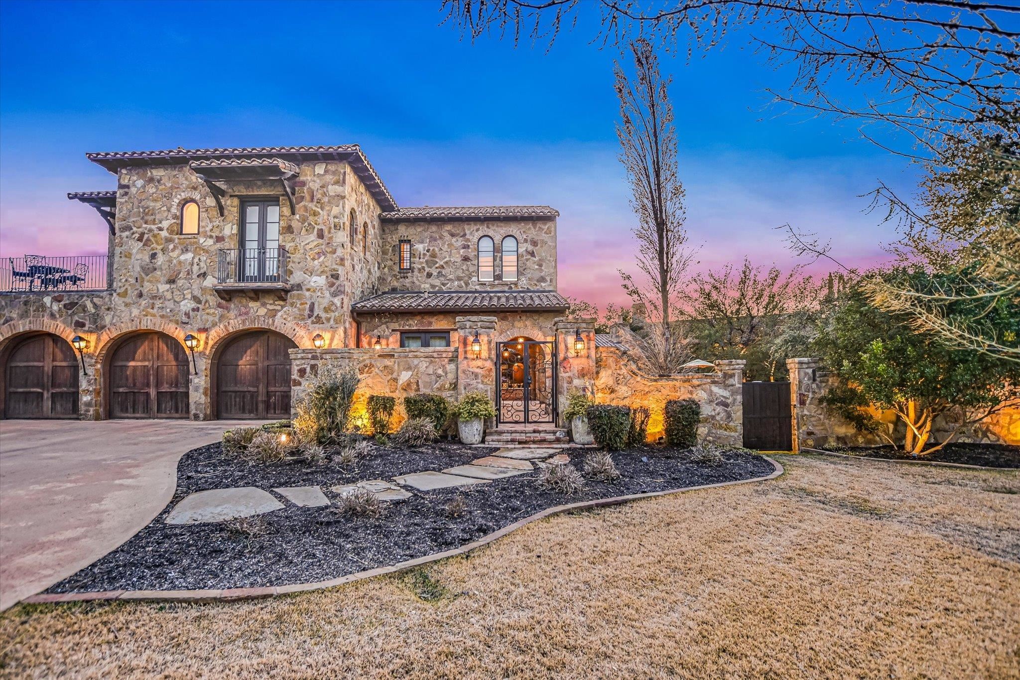 Nestled within the highly exclusive Escondido Golf & Lake Club, this exceptional custom furnished estate offers over 5,200 square feet of refined luxury, privacy, and effortless indoor–outdoor living. Thoughtfully designed with an open-concept floor plan, the home wraps around a negative edge pool and outdoor entertaining area.  The home features a primary suite with his and her closets, two generously sized upstairs guest suites, and a detached casita all with private patios. It also showcases stone accents, massive exposed beams, and high-end finishes throughout.  Designed with entertaining in mind, the home boasts a showstopping walk-up bar, game room with balcony overlooking the golf course, private office, and a one-of-a-kind “man cave” outfitted with a humidor, wine cellar, and lounge space that features an accordion door that makes the indoor and outdoor living seamless.  The chef’s kitchen is equipped with premium Thermador appliances, double dishwashers, and luxury finishes. The pool enjoys full sun exposure during the day while the patios are all shaded for relaxing or hosting year-round.  Ideally located directly across from the Lake Club and located near the 8th tee box, this home offers tons of privacy. A three-car garage and included furnishings — even a golf cart — make this property truly turnkey.