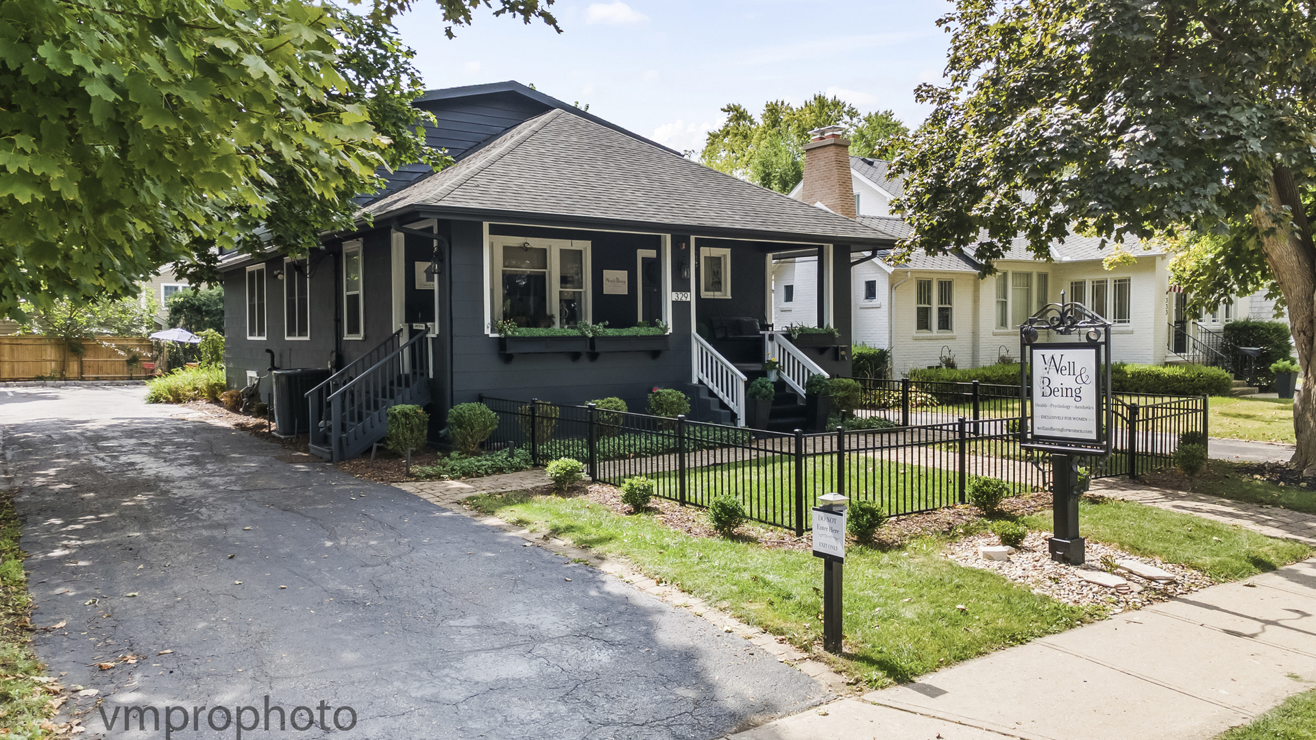 Mixed Use property currently being used as a business, but lives like a single family home. This charming home grabs your attention and doesn't let go.  2 car garage, 7 parking spaces and a wraparound driveway, easy in and out. A unique offering in highly desirable downtown Barrington .Use as a business -high visibility Main Street with short walk to Barrington HS, downtown and train.  A quaint fenced front yard opens onto the large inviting front porch & welcoming front door.  Fabulous new Kitchen stunner designed in 2025 w/ soft close cabinetry with crown molding, task lighting & above cabinet lighting.   Large gleaming quartzite counters w/ pendant lights allow plenty of prep area to gather around with friends and family for holidays and entertaining.  Huge island can accommodate 4-6 stools around the breakfast counter, farm sink & all  SS appliances & beverage refrigerator round out this great space.   Living Room/sitting area off the Kitchen has a beautiful picture window flanked by operable side windows. The luxurious full bath features an elevated vanity w/ "Villeroy & Boch" sink w/ "Grohe" polished gold fixtures & tub/shower with tile surround accessed by an original 3 panel door w/ fleurette glass panel & skeleton key hardware. Back office area can be a Family Room and the current owner has made an additional room for her business very functional with a new double bowl sink - could be converted to a first floor laundry Room if needed.  The 2nd floor has 3 bedrooms and one has a kitchenette set up (could be a break room) and the bath backs up to a large walk in closet - currently used as private office space.  The full lower level has another full kitchen, full bath and lots of space to spread out.  The functionality for a business or home is perfect and the wraparound driveway provides for easy access into and out of the property and there ae 7 parking spaces as well.  The solid 2 car garage has a new roof as well.  A must see for living/working in the village of Barrington.  Walk to Barrington HS and all the other conveniences downtown offers.