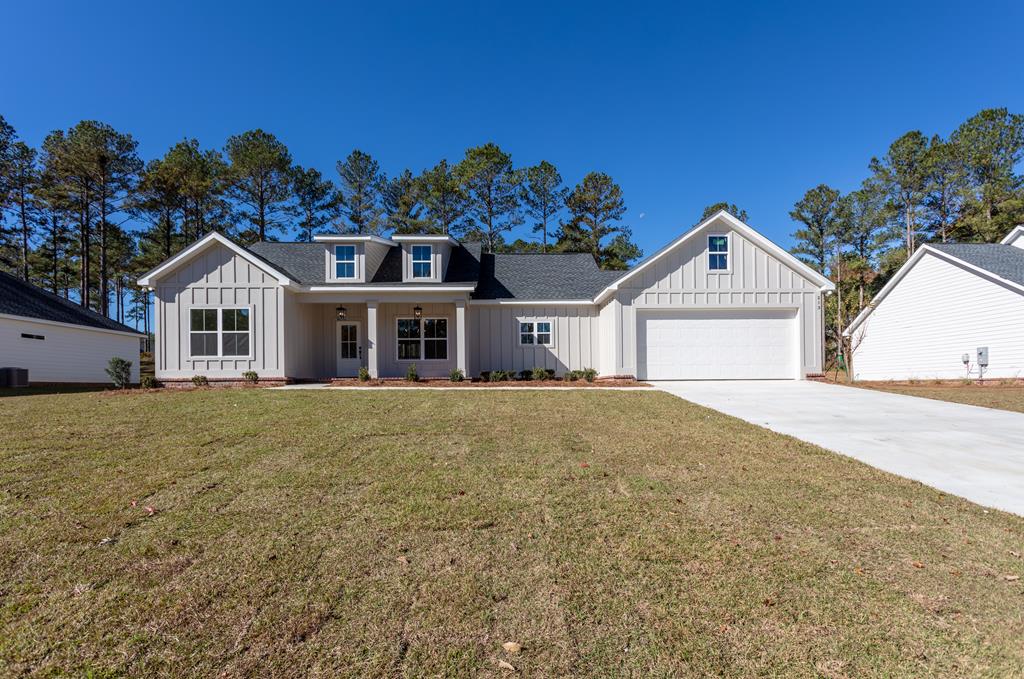 Welcome to 213 Bloomfield Dr. — where thoughtful design, elegance, and comfort meet.  This beautifully crafted 3-bedroom, 2-bath home offers an amazing floorplan with a total of 2,457 sq ft under roof, filled with abundant natural light and high ceilings with stunning tray accents that create a warm and inviting atmosphere throughout.  The home showcases herringbone-pattern brick pavers on the covered front porch, setting a timeless tone from the moment you arrive. Inside, you'll find White Pelican granite countertops, soft-close cabinetry, premium LVP flooring, and designer-selected fixtures—every detail expertly chosen by a professional interior designer for a cohesive, luxurious finish.  The spacious covered back porch provides the perfect setting for peaceful mornings, relaxing afternoons, and unwinding after a long day.  Located in the sought-after Bloomfield Lakes community, this neighborhood offers beautiful walking paths, tall pine trees, natural scenery, and serene water features throughout. It's ideal for outdoor lovers, dog owners, and anyone who appreciates nature-filled living and peaceful surroundings.  The seller is a licensed real estate broker in the State of Georgia, License #340473.