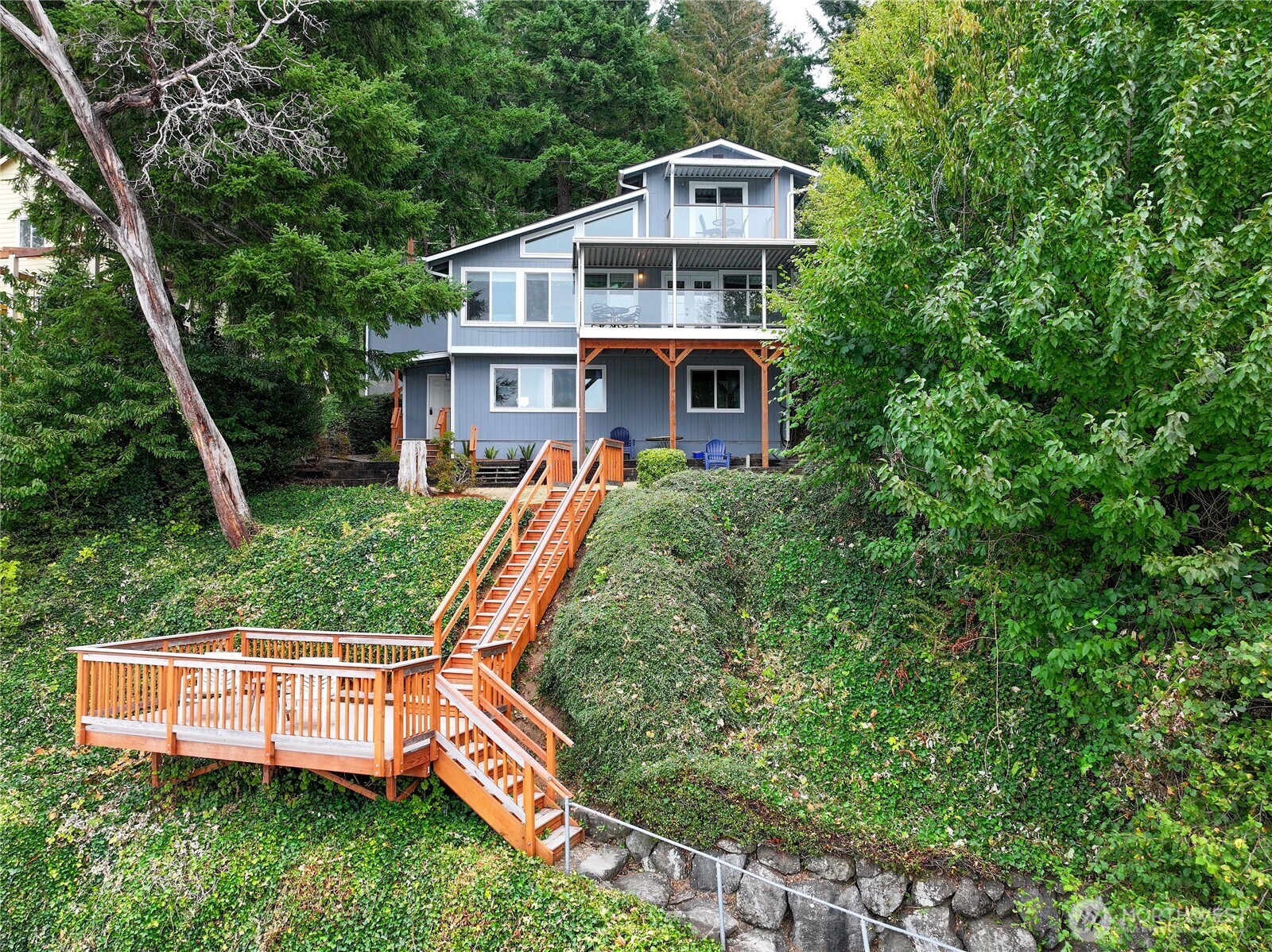 Wake up to the rhythm of the tide at this beautifully updated waterfront retreat on Oakland Bay, part of Puget Sound. Located in the Shorecrest Beach Club community, this property offers the rare combination of personal getaway and established short-term rental income—already operating as a successful, vacation rental.  Inside, the home features bright, open living spaces designed for gathering and relaxation, with large windows framing sparkling water views. Thoughtful updates create a fresh, welcoming interior that’s ready to enjoy from day one. A spacious deck overlooks the landscaped yard and shoreline—perfect for morning coffee, sunset dinners, or unwinding by the water. Direct access to the beach invites kayaking, paddleboarding, beachcombing, or simply watching the tide roll in across Oakland Bay. Ownership includes access to the Shorecrest Beach Club amenities, featuring a heated swimming pool, clubhouse, waterfront park, and boat launch—adding to the coastal lifestyle that draws people to this special corner of Puget Sound. Tucked along a quiet street yet within easy reach of Shelton and the Olympic Peninsula, this property offers an ideal blend of peaceful waterfront living and convenience. Whether you’re seeking a private Puget Sound retreat, a flexible getaway with income potential, or both, this waterfront home delivers a rare opportunity to enjoy the best of the Pacific Northwest.