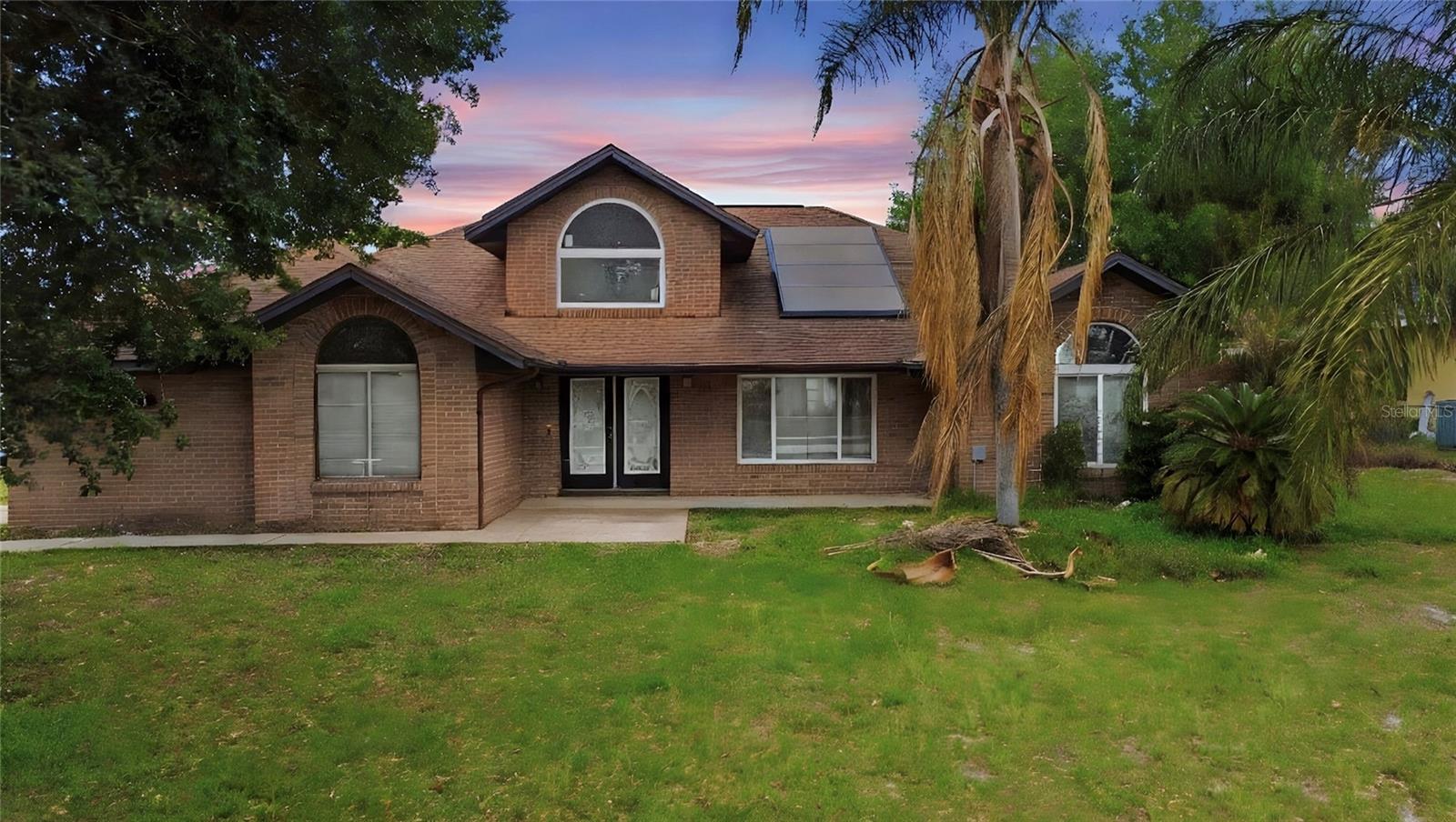 NO HOA | Fully Paid Solar Panels | Corner Lot Home | Large Family Room | Screened Porch | Oversized Garage Home located at 1731 Hazelton Ave in Deltona, situated on a desirable corner lot with plenty of space and functionality. The property includes fully paid solar panels with two Tesla backup batteries, providing energy efficiency and added peace of mind during outages—no lease and no extra payments.This property features a spacious family room, perfect for gatherings and everyday living, along with a separate living area and dining space that provide flexibility for entertaining. The kitchen is centrally located and connects easily to the breakfast nook and main living areas, creating a practical and comfortable layout.The home offers multiple bedrooms with ample closet space, including a primary suite with its own private bath.Recent updates include a roof replacement (2019), HVAC system (2019), updated electrical panels and grounding system (2022), and windows replaced (2021), providing added value on major components.Highlights include:• Large family room• Screened-in porch ideal for relaxing or entertaining• Oversized garage with plenty of storage space• Functional layout with separate living and dining areas• Corner lot with added privacy and yard spaceEnjoy outdoor living in the screened porch overlooking the backyard ... Florida living at its finest.Conveniently located with easy access to I-4, approximately 20–40 minutes to the beaches and Downtown Orlando, and close to shopping, dining, and everyday conveniences.Great opportunity with added value, efficiency, and backup power. Schedule your showing today.