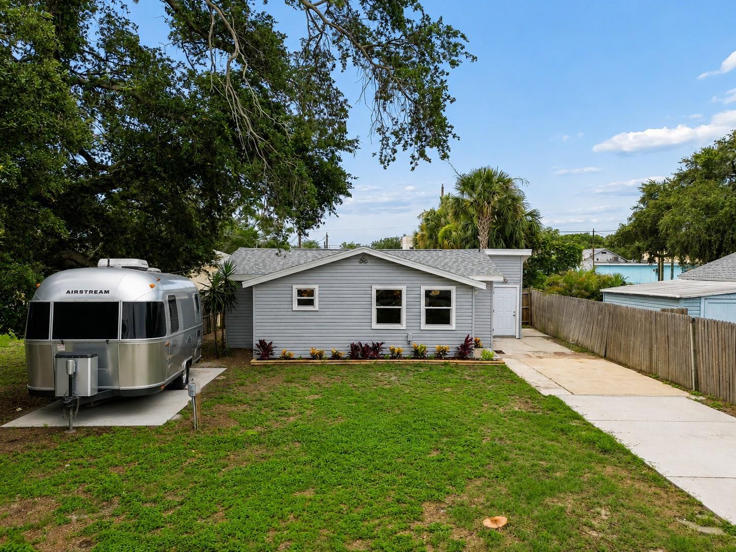 Renovated coastal-modern home in the heart of Largo! Fully updated and move-in ready, this stylish property combines designer finishes, functional living spaces, and an unbeatable location just minutes from beaches, parks, dining, and entertainment.Inside, you’ll find a bright open layout featuring luxury vinyl plank flooring throughout, recessed lighting, modern fixtures, and a stunning chef-inspired kitchen with shaker cabinetry, quartz countertops, stainless steel appliances, custom tile backsplash, and a movable island, perfect for entertaining. The thoughtfully designed interior offers beautifully updated bathrooms with frameless glass shower enclosures, contemporary vanities, and elegant tile work that create a true spa-like feel.The bedrooms provide comfortable retreats with abundant natural light. The living room and kitchen area spacious with a wide open space. Outside, the property features fresh landscaping, ample parking, and dedicated space for your boat, RV, trailer, or recreational toys — a rare find this close to the Gulf beaches.Located just minutes from Downtown Largo, residents enjoy easy access to local restaurants, breweries, coffee shops, shopping centers, and year-round community events. Popular nearby dining destinations include waterfront seafood restaurants, casual beach bars, local cafés, and the growing West Bay Drive dining corridor. Retail and entertainment options are nearby at Largo Mall, Seminole City Center, Clearwater Mall, and the surrounding retail districts.Outdoor enthusiasts will love being close to Largo Central Park, Eagle Lake Park, John S. Taylor Park, Largo Central Park Nature Preserve, and the Pinellas Trail, offering walking trails, playgrounds, picnic areas, sports courts, and scenic nature views. The home is also only a short drive to some of Florida’s most famous Gulf Coast beaches including Indian Rocks Beach, Belleair Beach, Sand Key, and Clearwater Beach with white sand, waterfront dining, boating, fishing, and stunning sunsets.With its designer updates, flexible parking options, and prime central Pinellas County location, this home offers the perfect combination of style, convenience, and Florida lifestyle living.