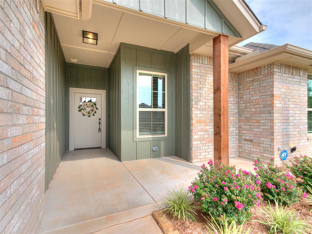 Beautiful Craftsman-style home situated on a desirable corner lot in a cul-de-sac! This thoughtfully designed home offers 4 bedrooms, 2 bathrooms, a 3-car garage, plus an enclosed patio room that provides fantastic additional flex space—perfect for a home office, playroom, hobby room, or relaxing retreat.  Step inside to a welcoming living area featuring a gorgeous gas fireplace and an open layout that flows beautifully into the kitchen. The kitchen combines warm and bright finishes with a light-stained wood island, white quartz countertops, white painted cabinetry, and under-cabinet lighting. All bedrooms feature brand-new carpet, giving the home a fresh, move-in-ready feel. The spacious primary suite is a standout! The primary bath features a large walk-in shower with dual shower heads, while the impressive walk-in closet offers custom built-in shelving and dresser storage, plus abundant upper and lower hanging space.  Outside, enjoy fresh new landscaping in the front with a wonderful sitting porch, an underground sprinkler system, and a beautiful cedar pergola in the back that creates an inviting space for relaxing or entertaining. The 3-car garage includes openers on both overhead doors for added convenience.  With its Craftsman charm, flexible living space, beautiful finishes, and thoughtful upgrades, this home offers a wonderful combination of style, function, and comfort!