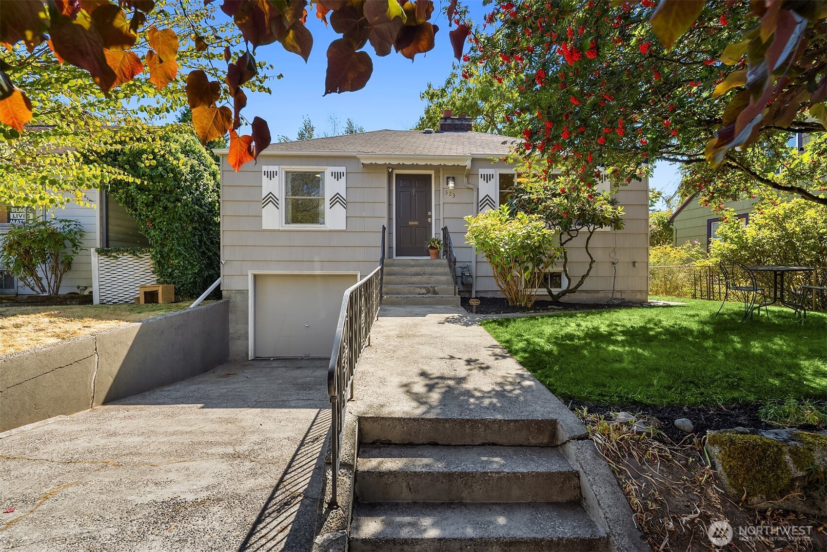 Beautifully updated and ready to enjoy, this charming Greenwood bungalow offers classic Seattle character, modern improvements, and an exceptionally convenient location. Featuring 2 bedrooms and 1 bath, the home has a bright, functional layout designed for comfortable everyday living. Tastefully renovated throughout, including a new kitchen, updated bathroom, refinished hardwood floors, fresh paint, new trim, and much more. The welcoming living room features a wood-burning fireplace and flows into the dining room, while both bedrooms and the full bath are conveniently located on the main level. Downstairs, the partially finished basement offers laundry, generous storage, and plenty of potential for a future rec room, home office, or third bedroom. An extended attached garage provides additional space for bikes, gear, or storage. Outside, the deck leads to a level, fully fenced backyard with alley access - perfect for relaxing, entertaining, or play. Set on a quiet residential street just minutes from Greenwood Avenue’s coffee shops, restaurants, groceries, and everyday conveniences, with Ballard, Phinney Ridge, and Green Lake all nearby.