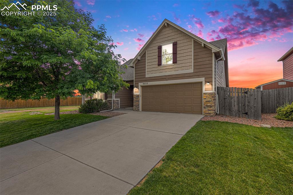 Welcome to 9455 Sand Myrtle Drive! An exceptional home offering comfort, space, and mountain views in a peaceful
 neighborhood setting! This beautifully maintained 3-bedroom, 2-bathroom residence features soaring ceilings on the main
 floor and a functional layout perfect for modern living. The spacious family room boasts luxury vinyl plank flooring, a
 vaulted ceiling, and a lighted ceiling fan, seamlessly flowing into the dining area and well-equipped kitchen. The kitchen
 includes abundant cabinet space, laminate countertops, and black appliances including refrigerator, electric range,
 microwave, dishwasher, and disposal all included! The main level also features two carpeted bedrooms with double door
 closets, a full tiled bathroom, and an oversized primary suite with a walk-in closet, en suite bathroom, and ceiling fan.
 Upstairs, the loft has been converted into a large bedroom with its own walk-in closet, offering flexible use for guests, an
 office, or additional living space. Enjoy added conveniences like a dedicated laundry/mudroom with washer, dryer, tile
 floors, and built-in shelving. The fully insulated and drywalled 2-car garage includes an automatic opener, and the home is
 equipped with central A/C, gas furnace, composition roof, and an alarm system. Step outside to a fully fenced, level yard
 backing and siding to open green space with stunning Pikes Peak views. A covered front porch, front and rear sprinklers,
 and low-maintenance cement and stone siding complete the exterior. Located just steps from a neighborhood park and
 green space, and within easy reach of Peterson and Schriever Space Force Bases. This home offers it all!