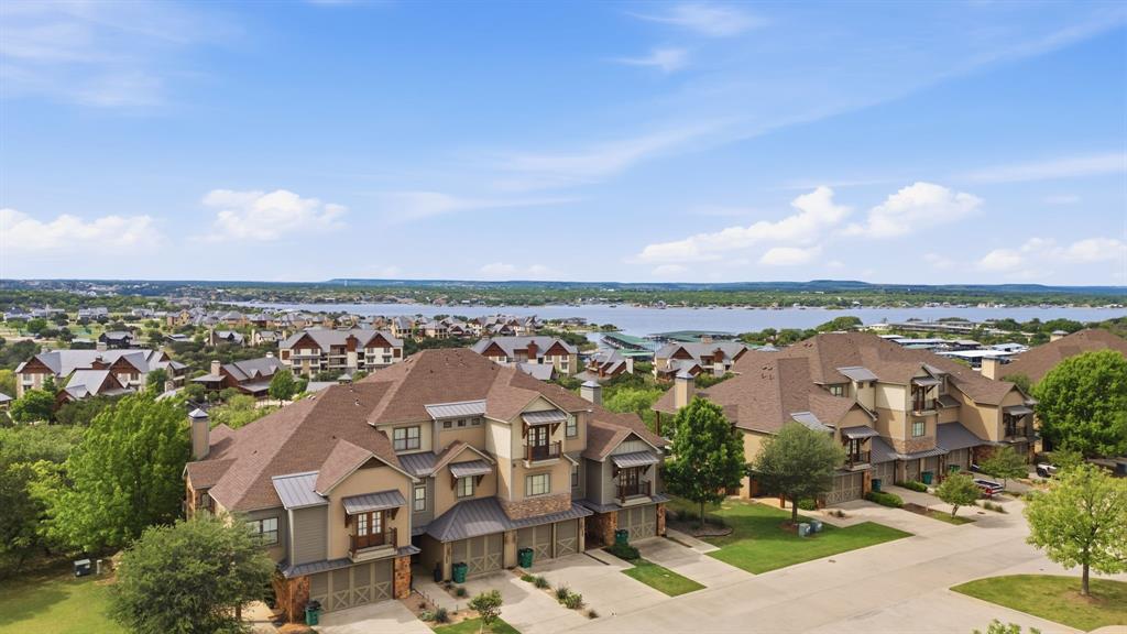 Welcome to this charming, fully furnished villa nestled within the highly sought-after Harbor community. Designed for effortless living, this turnkey residence offers an inviting open-concept layout, seamlessly connecting the living, dining, and kitchen spaces—perfect for entertaining or relaxing after a day on the lake.Featuring 3 spacious bedrooms, 2.5 baths, and an attached garage, this home blends comfort with convenience. Enjoy exclusive access to resort-style amenities, making every day feel like a getaway. Whether you're searching for a weekend escape or a low-maintenance full-time residence, this villa delivers the ideal combination of style, ease, and lifestyle.