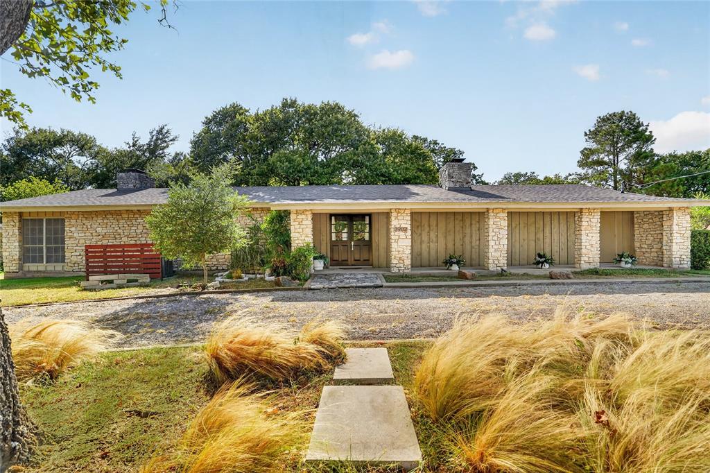 Charming and whimsical ranch-style home in true DCBE fashion! This GOLF COURSE LOT sits right off the 12th hole, only a 5-minute bike ride, 21-minute walk or 3-minute drive to the DeCordova Bend Estates Country Club for year-round leisure and entertainment. This 2 bedroom, 2 bathroom home sits on a large corner lot, tucked into a quiet cul-de-sac with mature trees and golf course views. Inside are 2 full primary suites, 2 fireplaces and a 2-car garage, with large Granbury stone carrying from the exterior into the home. Tons of charm and character throughout, including a beautiful naturally lit hallway, large windows, generous living spaces and a floor plan that offers privacy, grace and functionality. BRAND-NEW ROOF, fresh paint and new carpet! The charm continues into the kitchen and open-concept living and dining area, with plenty of opportunity to eventually add new flooring or create a custom kitchen of your own. Outside, enjoy mature trees, a stone patio, new deck and the golf course right beyond the backyard. Move in and fully embrace the country club lifestyle in one of Granbury’s most established gated and guarded communities, with golf, dining, swimming, pickleball, marina and Lake Granbury access all close to home. Life is simpler here.