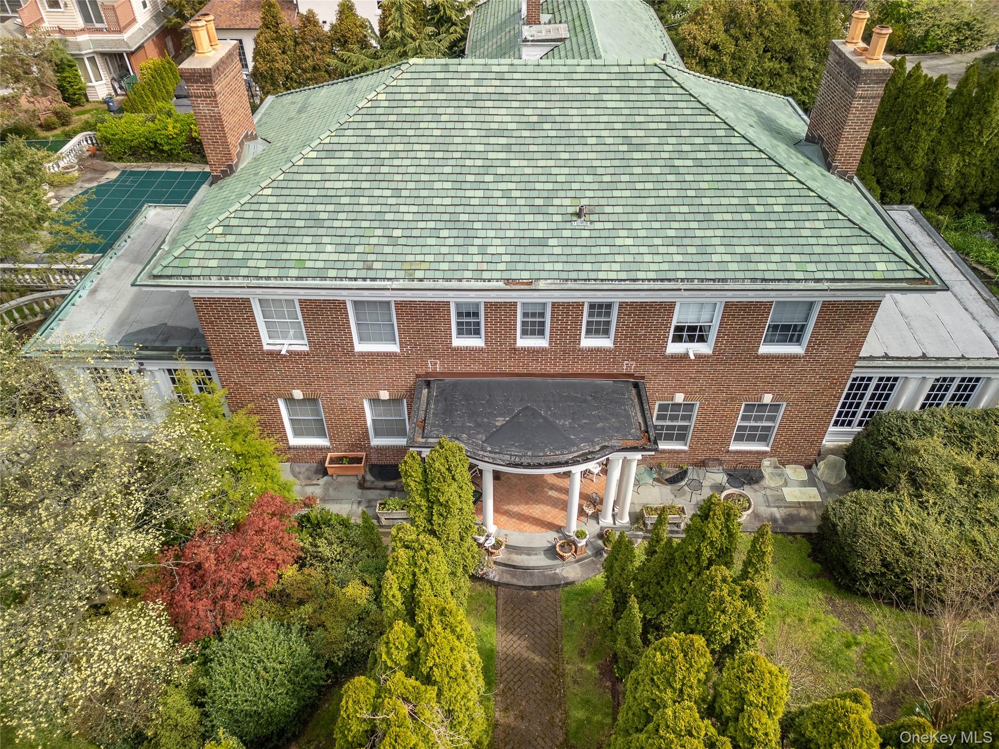 Discover the grandeur of Colonial Revival, a stately historic landmarked mansion set in the prestigious Douglaston Historic District. Built in 1917, this exquisite property seamlessly blends historical elegance with modern luxury. It boasts 6 bedrooms, 6.5 bathrooms, and is equipped with a new boiler and gas backup generator for optimal climate control. The home features 4 elegantly enclosed porches that provide serene areas perfect for relaxation or entertaining guests. The dedicated library room offers a quiet retreat for book lovers, while the lavishly appointed dining and living rooms are designed for comfortable living and hosting memorable gatherings. The gourmet open kitchen, complete with modern amenities and a separate butler's pantry, is tailor-made for culinary excellence and seamless entertaining. Additional amenities include a vast, adaptable basement with dual external entries and a spacious attic accessible by a full staircase-ideal for conversion into an artist's loft or for extra storage. The functionality of the home is enhanced by three beautifully crafted staircases to the second floor, ensuring smooth flow throughout. Colonial Revival is more than just a residence; it's a statement of lifestyle in a community that values heritage and exclusivity. This serene suburban haven is just moments away from the city's pulse, providing an ideal balance of peaceful living with urban accessibility. Experience the unparalleled charm and luxury of 127 Beverly Road. Schedule your private viewing today and see how this historic mansion can become your prestigious new home. AKA 127 Beverly Road Lot 33 and Lot 38 Lot 33 130x110 Lot 38 100x105 24,800 sqft Lot