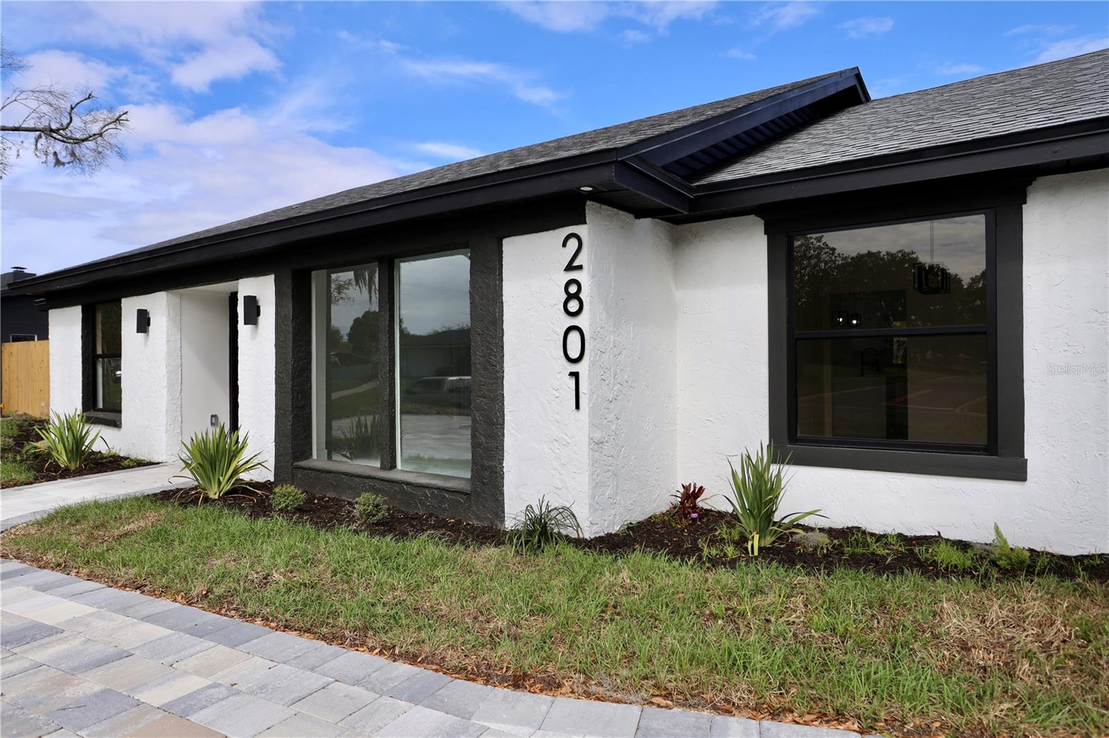 Welcome to Dommerich Hills, where modern style meets everyday comfort. This beautifully renovated home offers the freedom of **NO HOA** and has been thoughtfully updated from top to bottom. From the paver driveway and elegant double-door entry to the bright, open-concept interior, every detail has been designed to make you feel at home.The heart of the home is a stunning chef-inspired kitchen featuring sleek custom cabinetry, stainless steel appliances, and a striking waterfall island with custom wood accents,perfect for entertaining family and friends. The spa like bathrooms has glass-enclosed showers, contemporary fixtures, and designer finishes that create a relaxing retreat.Step outside and discover your own private Florida oasis. A covered lanai overlooks the sparkling pool and expansive paver patio, creating the ideal space for outdoor dining, weekend gatherings, or simply unwinding in the sunshine.Conveniently located just minutes from major highways, shopping, dining, and entertainment, this beautifully renovated home combines modern design with everyday functionality. Schedule your private showing today and experience everything this exceptional property.