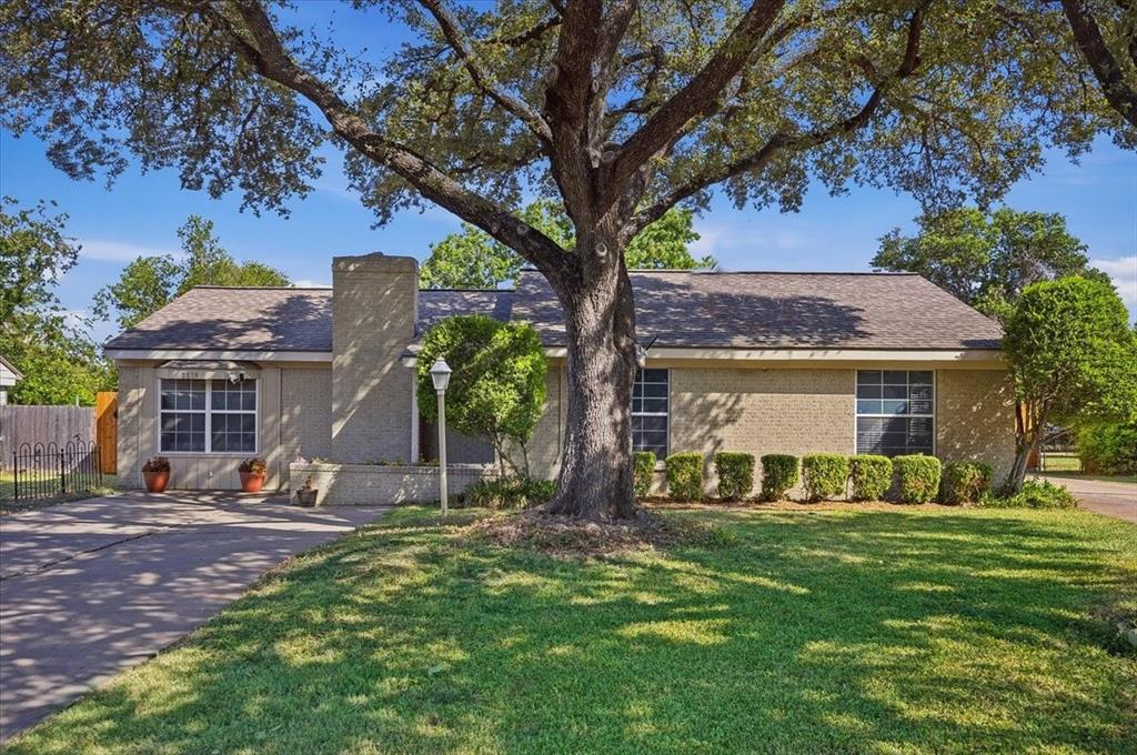 Charming single-story home with a flexible floor plan and an incredible backyard built for enjoying Texas summers. Inside, hardwood floors welcome you into a versatile front living space that could easily serve as a home office or sitting room. The spacious family room features a fireplace and opens to the dining area and kitchen. The kitchen offers granite countertops, tons of cabinets, an island and walk-in pantry. The large primary suite includes a private bath and walk-in closet, while two additional bedrooms and a second full bath complete the home. The oversized laundry room provides excellent storage and workspace. Backyard boasts a large in-ground pool, expansive patio, covered outdoor living and entertaining area, mature trees and a fenced backyard. Covered parking and gated access provide added convenience.