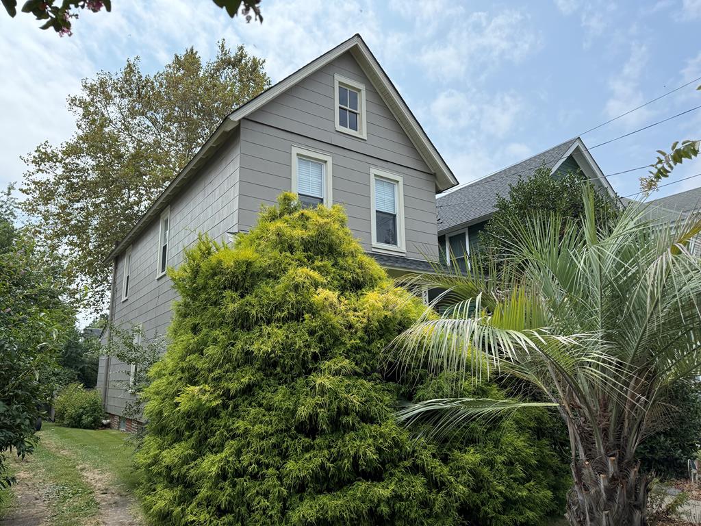 Historic home w/lush landscaping in the heart of Cape Charles is being sold furnished. Impeccably maintained & has been updated w/care over the years by very conscientious owners. New roof & exterior painting completed in 2022 new mini splits in 2021. Very warm & hospitable w/ open living plan. Updated kitchen & powder room on first floor. Beautifully refinished wood floors & 9 foot ceilings. Upstairs 3 bedrooms & full bath. Backyard is an oasis w/ secret garden, shed , established trees, shrubbery & fabulous new artisan patio. Walking distance to all town has to offer: shops, restaurants, galleries &theatre. 4 1/2 blocks to Cape Charles beach & fishing pier. This is a great vacation home as it is easy to maintain and still in an affordable price range. Great vacation rental potential!