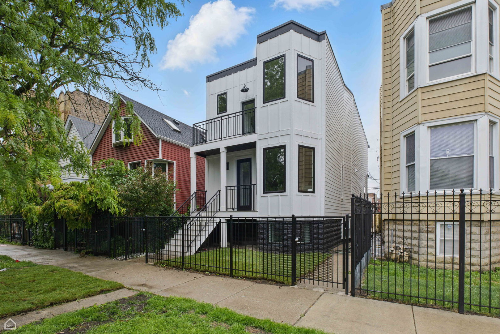 Don't miss the opportunity to own this stunning, fully renovated single family home in the heart of Logan Square. Meticulously remodeled, this 5 bedroom, 3.5 bathroom home pairs high end design with superior attention to detail. The entry opens to a bright and airy dining room featuring expansive wide-plank flooring, detailed custom millwork, and a gas fireplace with a quartz surround framed by arched built ins.The chef's kitchen features double stacked custom white cabinetry, a premium stainless steel appliance package, and a handcrafted wood wrapped hood. A striking quartz waterfall island anchors the space. The kitchen flows into a relaxing family area enhanced by custom built in shelving, providing elegant storage while maintaining a streamlined design. Upstairs, the luxurious primary suite includes a private deck, an expansive walk in closet, and a spa caliber ensuite bath. This retreat features floor to ceiling Calacatta marble tile, a double vanity complete with a soaking tub, rain showerhead, and handheld body spray. Two additional bedrooms, a full bath, and a well appointed laundry room with side by side machines and floating shelves complete this level. The fully finished lower level offers exceptional flexibility with a generous rec room, a sleek quartz topped wet bar and wine fridge, two additional bedrooms, and a full bathroom. Additional features include a functional mudroom off the rear entry, zoned HVAC, a backyard, and a detached 2 car garage. Ideally located just steps from the Armitage restaurant row, Palmer Square, the 606 Trail, and within easy reach of the Logan Square Blue Line and Healy Metra Station. Designed with both style and function in mind, this Logan Square beauty offers exceptional living in a prime location. Schedule your private tour today and make this Logan Square gem your own.