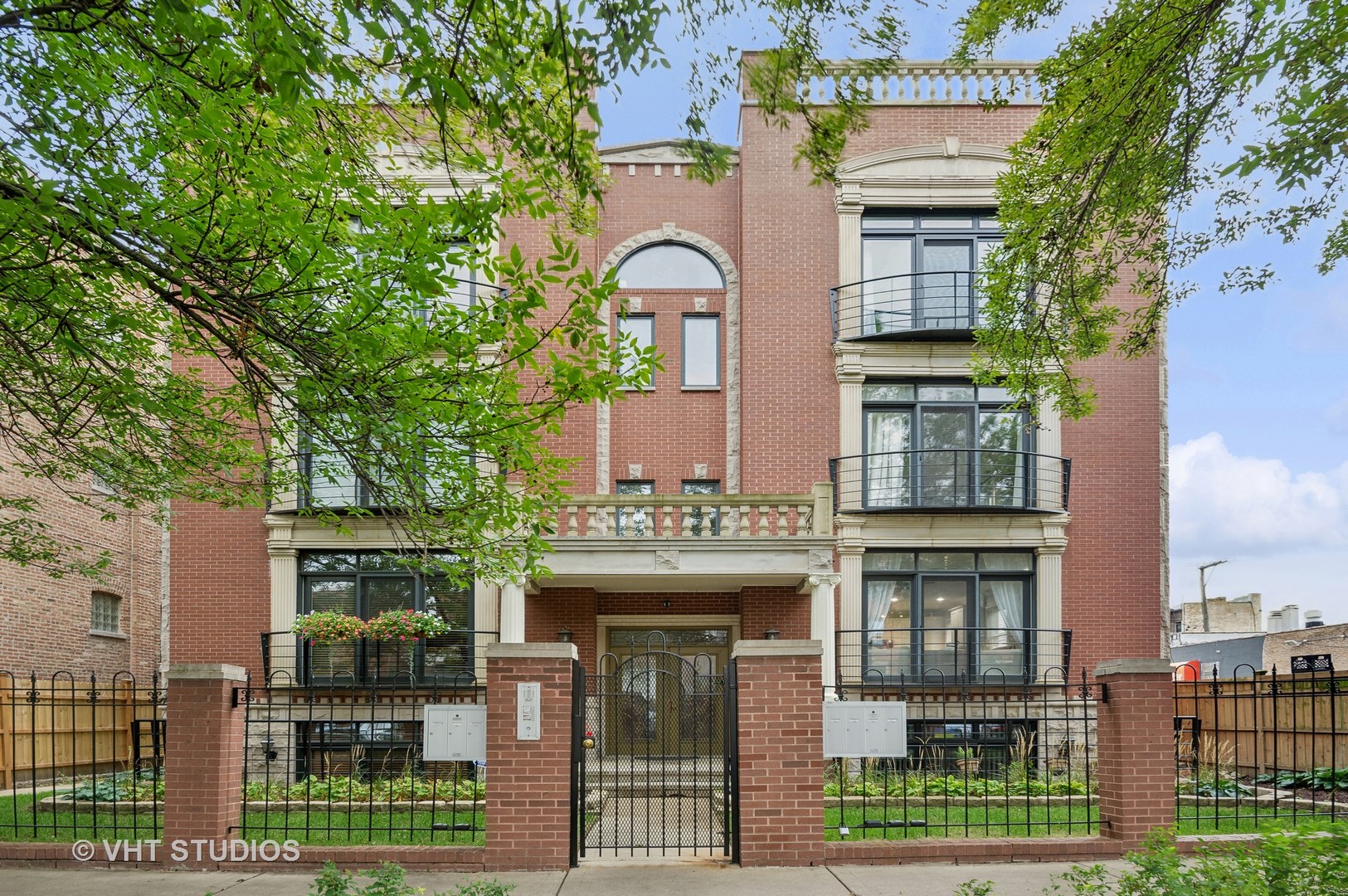 Welcome to 2339 W Rice St, Unit C - a beautifully updated, extra-wide 2-bedroom, 2-bathroom condo located on a quiet, tree-lined street in the heart of Ukrainian Village! This spacious, sun-drenched home offers approximately 1,500 square feet of open-concept living. Renovated in 2018 this unit features walnut stained hardwood floors and updated finishes throughout. The expansive living and dining area is perfect for entertaining and includes a cozy gas fireplace and ample natural light. The chef's kitchen boasts stainless steel appliances, granite countertops, a large island with breakfast bar seating, white contemporary cabinetry, and a deep farmhouse sink. Both full bathrooms have been tastefully renovated-highlighted by a luxurious primary ensuite with a whirlpool tub, separate shower, and dual vanity. Additional comforts include in-unit laundry, central air, a newer furnace and A/C, and forced-air gas heating. Enjoy outdoor living on your oversized private deck, ideal for relaxing or entertaining. The home also includes a detached one-car garage space and storage unit.  Low monthly HOA dues of $210 cover exterior maintenance, lawn care, common insurance, and scavenger services. Located just steps from neighborhood parks, restaurants, shops, and public transportation, this move-in-ready condo offers the perfect blend of convenience, comfort, and style in one of Chicago's most sought-after neighborhoods.