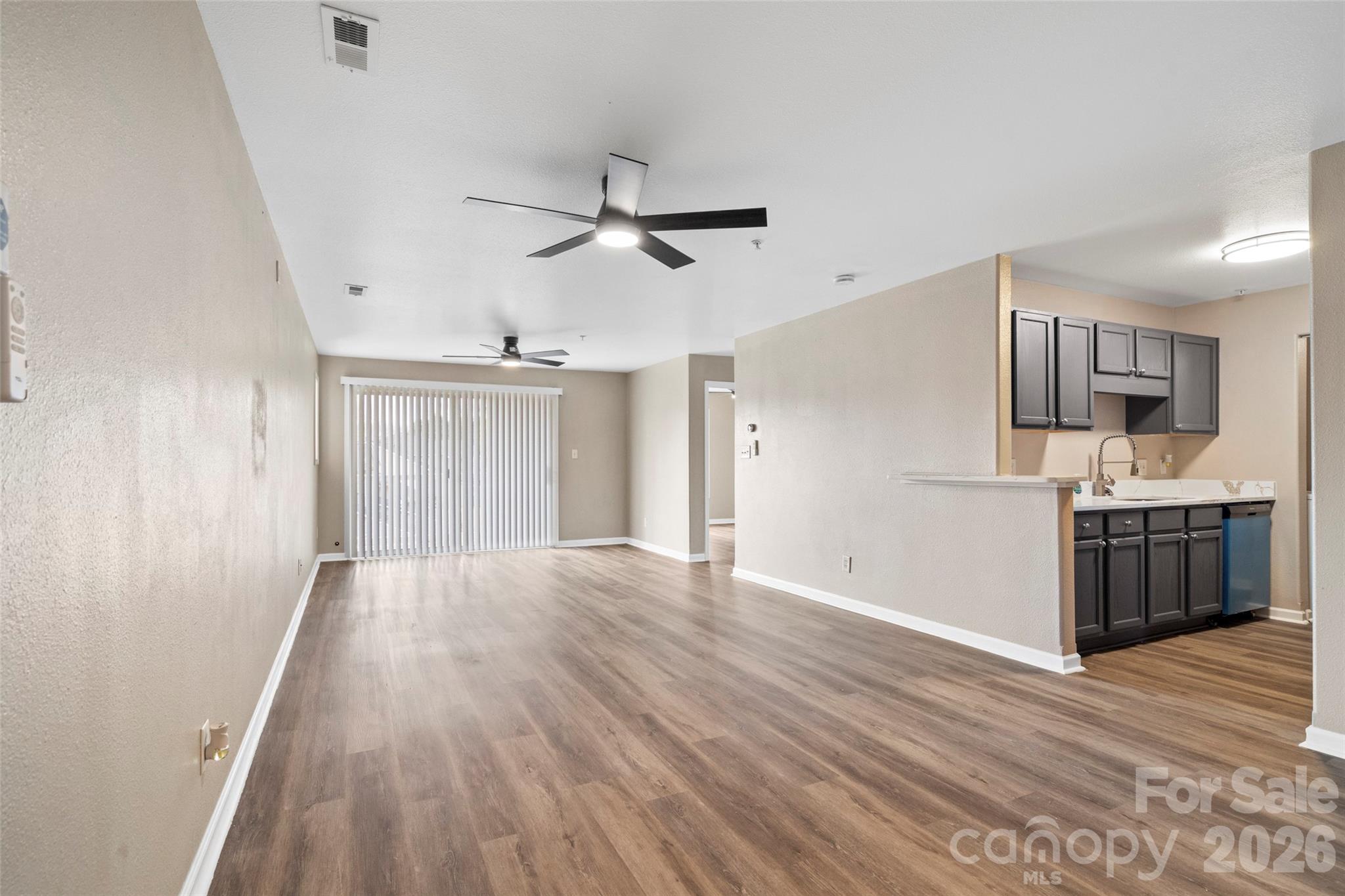 Experience elevated living in this fully remodeled third-floor residence, minutes from Uptown Charlotte. Bathed in natural light, the sunlit primary suite features oversized windows for serene mornings and quiet evenings. The interior has been thoughtfully refreshed with crisp paint and waterproof LVP flooring, creating a seamless, contemporary palette throughout. Entertain in a stunning, chef-inspired kitchen finished with luminous quartz countertops, a large farmhouse sink, new stainless appliances, and elegant nickel fixtures. Both bathrooms echo the same refined aesthetic with quartz surfaces, designer lighting, and modern hardware. Home has a new queen bedroom set, sectional living room set with live edge tables and a custom dining table all included with the sale of this unit!!!! Relax on your covered patio—an intimate outdoor retreat that includes a private storage closet—and enjoy community luxuries such as a sparkling outdoor pool and a stylish clubhouse available to owners and renters. Perfectly situated near Plaza Midwood and NoDa with easy Light Rail access, this home blends comfort, style, and convenience in one of Charlotte’s most desirable neighborhoods. 1 Year home warranty included. Schedule your private tour today and discover effortless, sophisticated living.