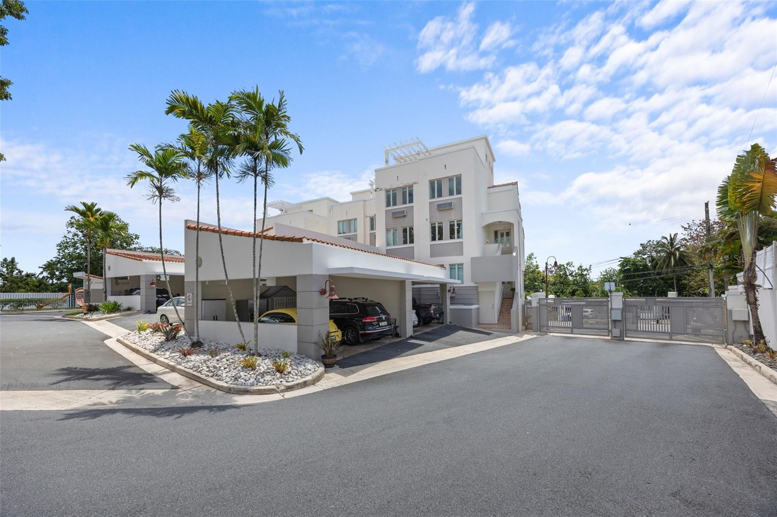 Filled with abundant natural light and exceptionally spacious throughout, this residence enhances comfort and exudes a bright ambiance. A distinguished three-level penthouse featuring soaring ceilings and an open-concept design. The residence offers four bedrooms, three full bathrooms, and two powder rooms, complemented by a versatile flex room. Outdoor living is elevated with a private terrace on the third level and balconies on both the first and second levels. Additional features include a two-car garage and a private water cistern. Set within an exclusive boutique condominium of just 20 residences, the community offers a full backup power generator, swimming pool, playground, and ample visitor parking. Ideally located in Guaynabo, the property enjoys close proximity to premier private schools such as Baldwin and Marista, as well as a wide array of dining options, 24/7 supermarkets, pharmacies, and Costco Wholesale. The residence also offers excellent connectivity to major roads, including PR-20 Martinez Nadal Expressway and Los Filtros Avenue.