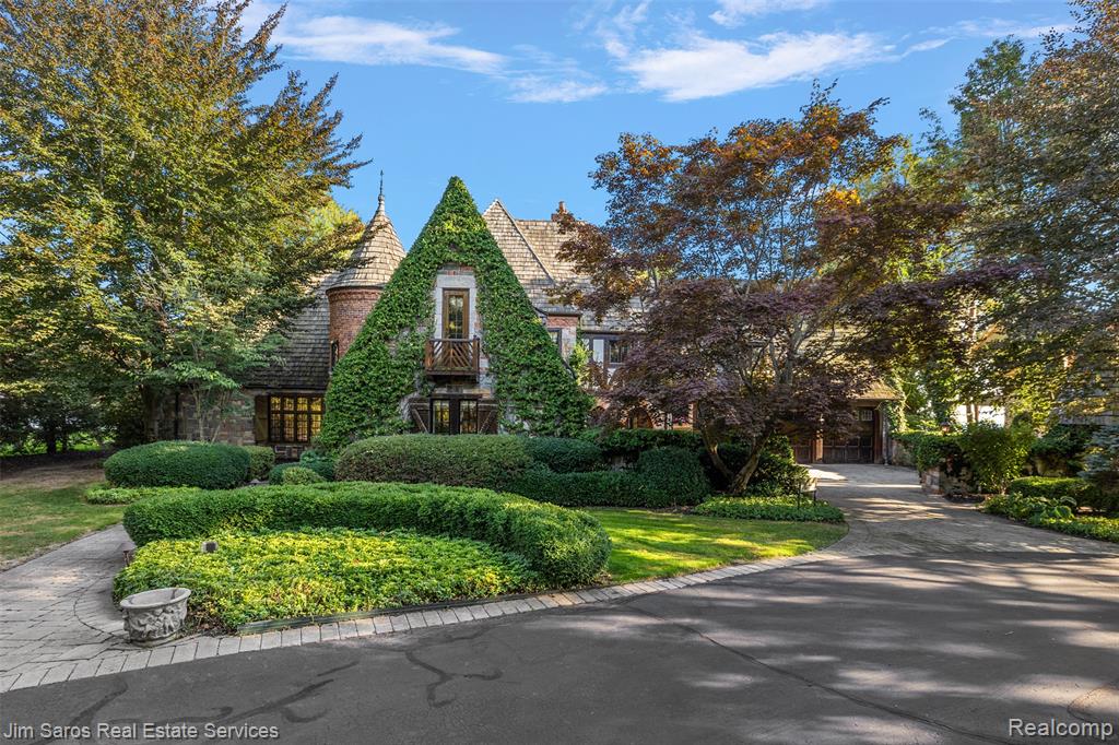 Presenting “The Castle” on Point Lakeview Drive, a breathtaking English Tudor estate tucked along 143 feet of pristine Lake St. Clair shoreline in Chesterfield’s exclusive Point Lakeview community, originally built for Guido Behn of the Hudson Motor Company.  A true masterpiece of design and craftsmanship, this one-of-a-kind lakefront retreat blends rich architectural detail with luxurious modern living. Set behind a private drive, the home immediately impresses with its stately presence and unmatched water views. Inside, a grand spiral limestone staircase, custom woodwork, opulent lighting, and gleaming hardwood floors create an atmosphere of timeless sophistication. The gourmet kitchen is equally striking—featuring granite countertops, handcrafted cabinetry, a Wolf range, built-in refrigerator, and panoramic lake views. Flooded with natural light, the spacious living areas are designed for both elegant entertaining and quiet comfort. The primary suite is a private oasis with a walk-out terrace, fireplace, spa-like steam shower, and Jacuzzi tub. With three bedrooms, three full and three half baths, three fireplaces, a sunroom, and a stylish family room with built-ins, the layout is as functional as it is beautiful. Expansive stone patio, built in brick gas grill, private boardwalk, two boat hoists with remote lifts - all just steps from your back door. Additional six-car garage, whole-home generator, and proximity to top-rated schools, shopping, and downtown New Baltimore’s family friendly restaurant scene make this home as convenient as it is extraordinary. This is more than a home—it’s a legacy on the lake. Don’t miss your chance to own Chesterfield’s most iconic waterfront properties.