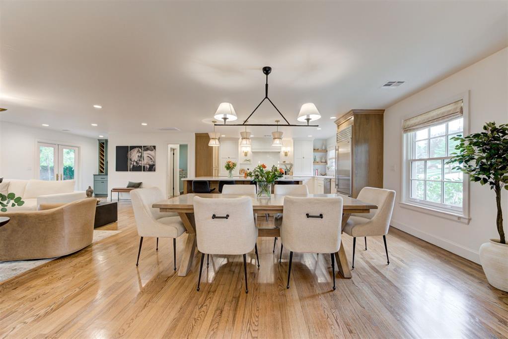 Stripped to the studs and fully reimagined! This Nichols Hills home will take your breath away from the moment you walk through the front door. Comprehensively reimagined in 2023, this home was remodeled and rebuilt with intention, combining original character with designer finishes, professional-grade systems, and thoughtful details throughout every space. The open floor plan is updated and sophisticated, yet still warm and inviting. With marble counters, custom milled white oak cabinetry and designer finishes, this home is dressed to impress. Multiple sitting areas, a large island, and dry bar leading to the backyard, all combine to create seamless indoor-outdoor flow and help make this perfect for entertaining friends and family alike. The first-floor primary is a true retreat, featuring a spa-inspired wet room and beautifully appointed ensuite. A unique pass-through laundry connects the space to the closet as well as wrapping around to the other first floor en-suite. Upstairs, a third ensuite offers flexibility as a bedroom, media room, or gym. Outside, the home continues to make a statement! Enjoy a fully appointed outdoor kitchen, fire pit and multiple seating areas that make this perfect for year-round gatherings. Water features, a Jack Wolfe sculpture and koi pond add to the home’s natural ambience. Backyard is fully turfed for low-maintenance living. Construction and design project were coordinated by LoneOak Custom Homes and Heather Lay Interiors. Don’t miss out on this marvelous Nichols Hills home…schedule your showing today!