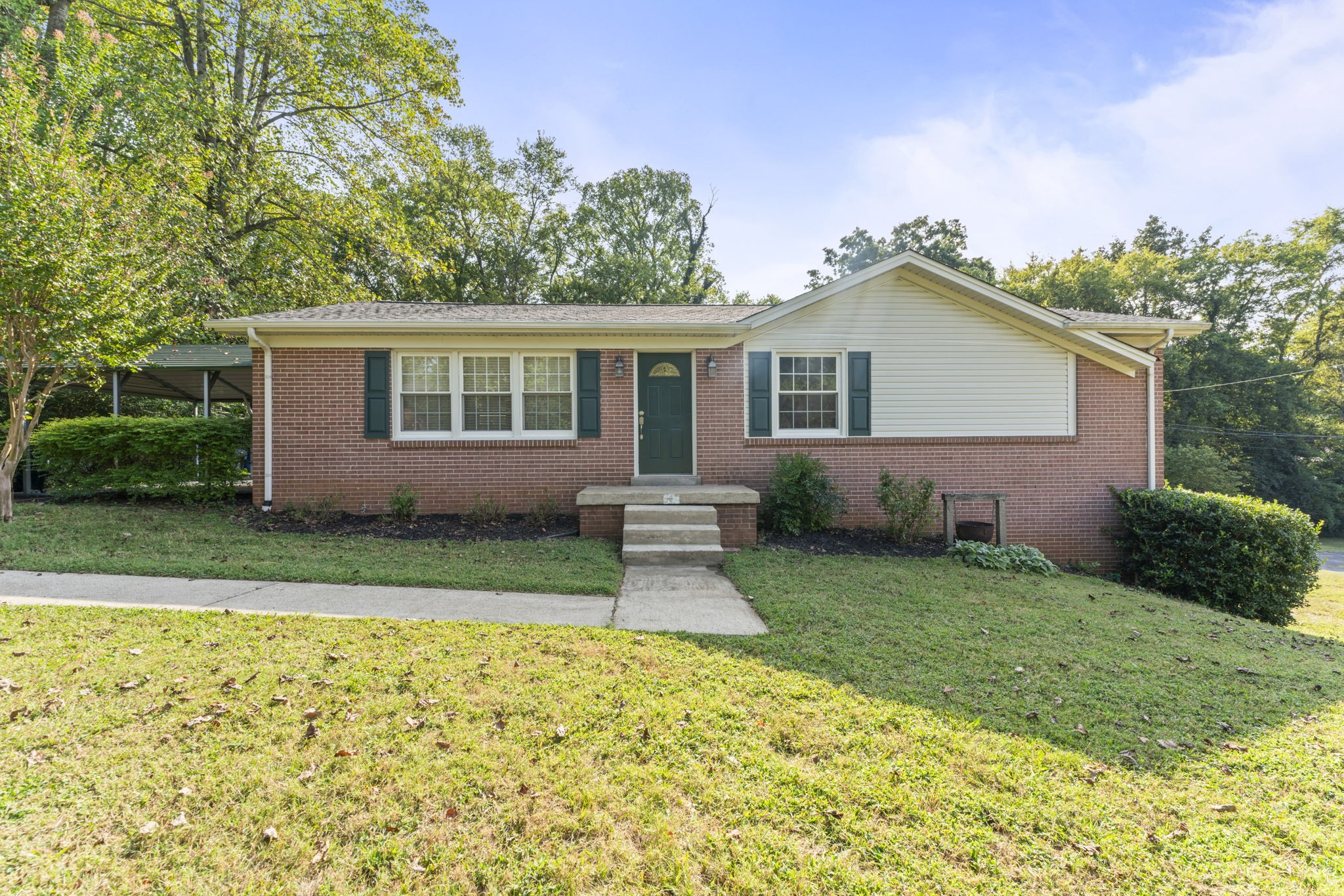 Brick basement home on a spacious lot in established Chantay Acres. This property offers an open living area with a remodeled kitchen featuring soft-close cabinets and granite countertops. Hardwood floors run throughout. The basement bonus room with a cozy fireplace offers flexible use and has previously served as a bedroom. Enjoy the covered side porch, plus the convenience of two driveways for extra parking.  A spacious two-car garage provides plenty of storage options. Roof 2020