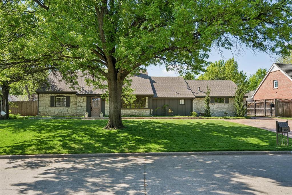 Nestled on one of Quail Creek’s most charming streets, this storybook stone cottage offers the perfect blend of timeless character, thoughtful updates, and an unbeatable location. Just minutes from some of Oklahoma City’s best restaurants, shopping, and major highways, this home places convenience and lifestyle at your doorstep. Inside, you’ll find a beautifully designed and highly functional floor plan featuring 3 bedrooms and 2.5 bathrooms, with a spacious primary suite conveniently located on the main level. The home was designed with entertaining in mind, offering two generous living areas and two dining spaces that create effortless flow for both everyday living and hosting guests. The heart of the home is the stunning living room, anchored by a gorgeous stone gas fireplace that adds warmth and architectural charm. Rich oak flooring runs throughout the home, complementing the updated kitchen with its beautiful countertops, stainless appliances, designer hardware, and refined finishes. Step outside to your private backyard retreat, complete with a covered patio perfect for relaxing evenings and a rare multi-purpose court that makes this property truly stand out. An attached 2-car garage provides additional convenience and storage. Homes with this level of character, updates, outdoor amenities, and location in highly sought-after Quail Creek are exceptionally hard to find at this price point. This is the kind of home buyers wait for—and it won’t stay on the market for long. Schedule your private showing today and experience the charm of Quail Creek living for yourself.
